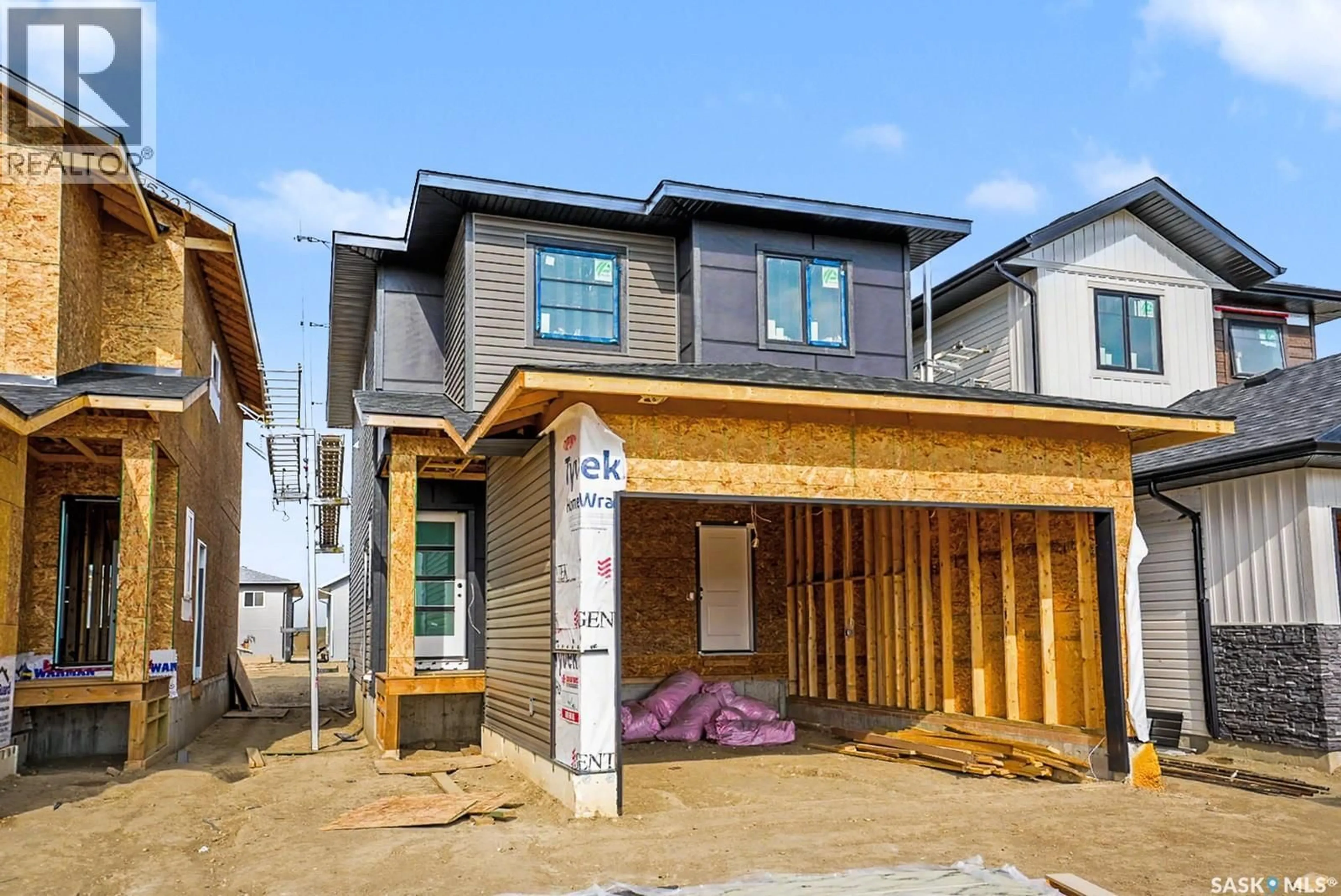 Home with brick exterior material, street for 667 HENRY DAYDAY ROAD, Saskatoon Saskatchewan S7W1H5