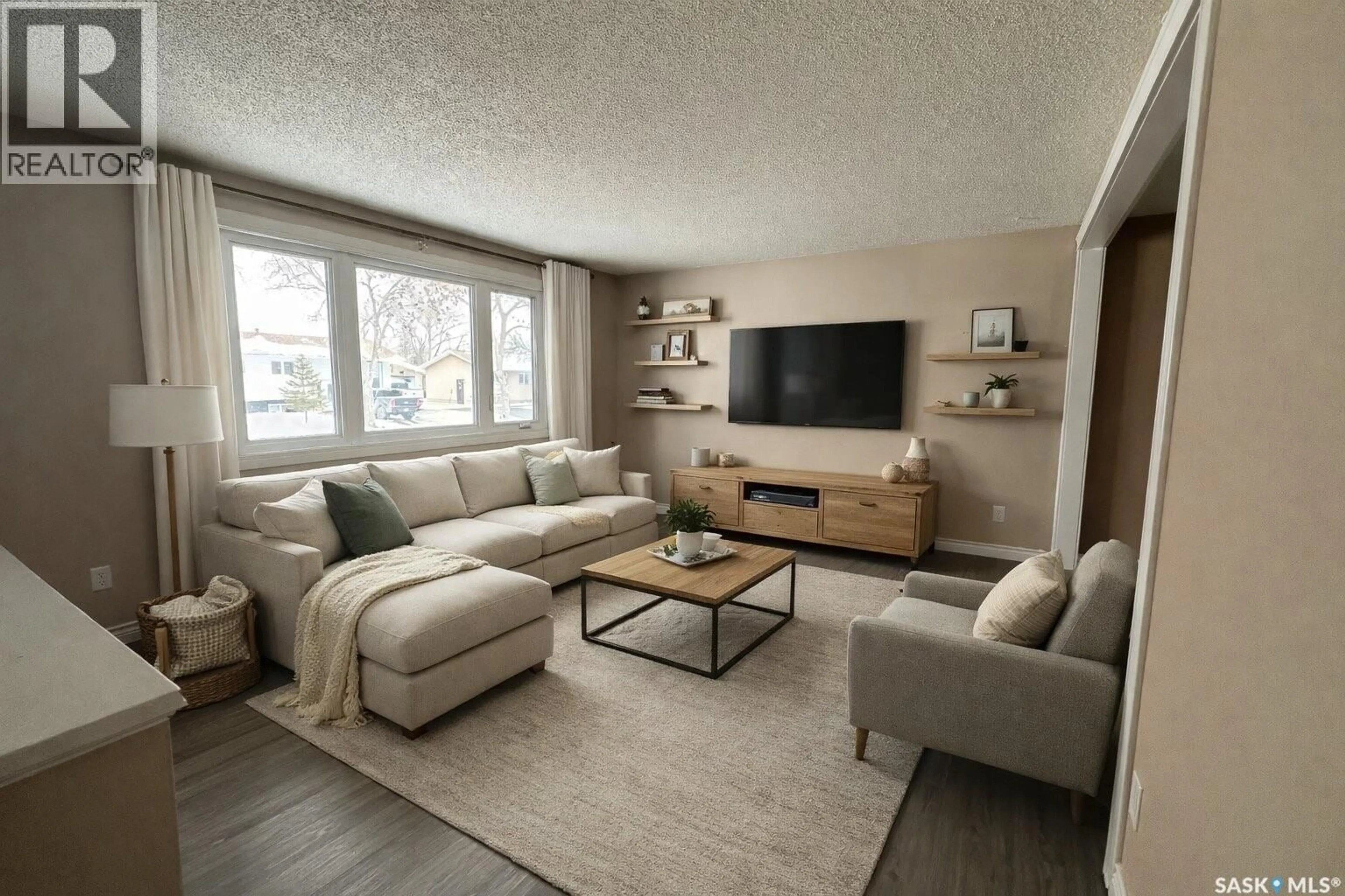 Living room with furniture, wood/laminate floor for 51 DENNY CRESCENT, Regina Saskatchewan S4N5J8