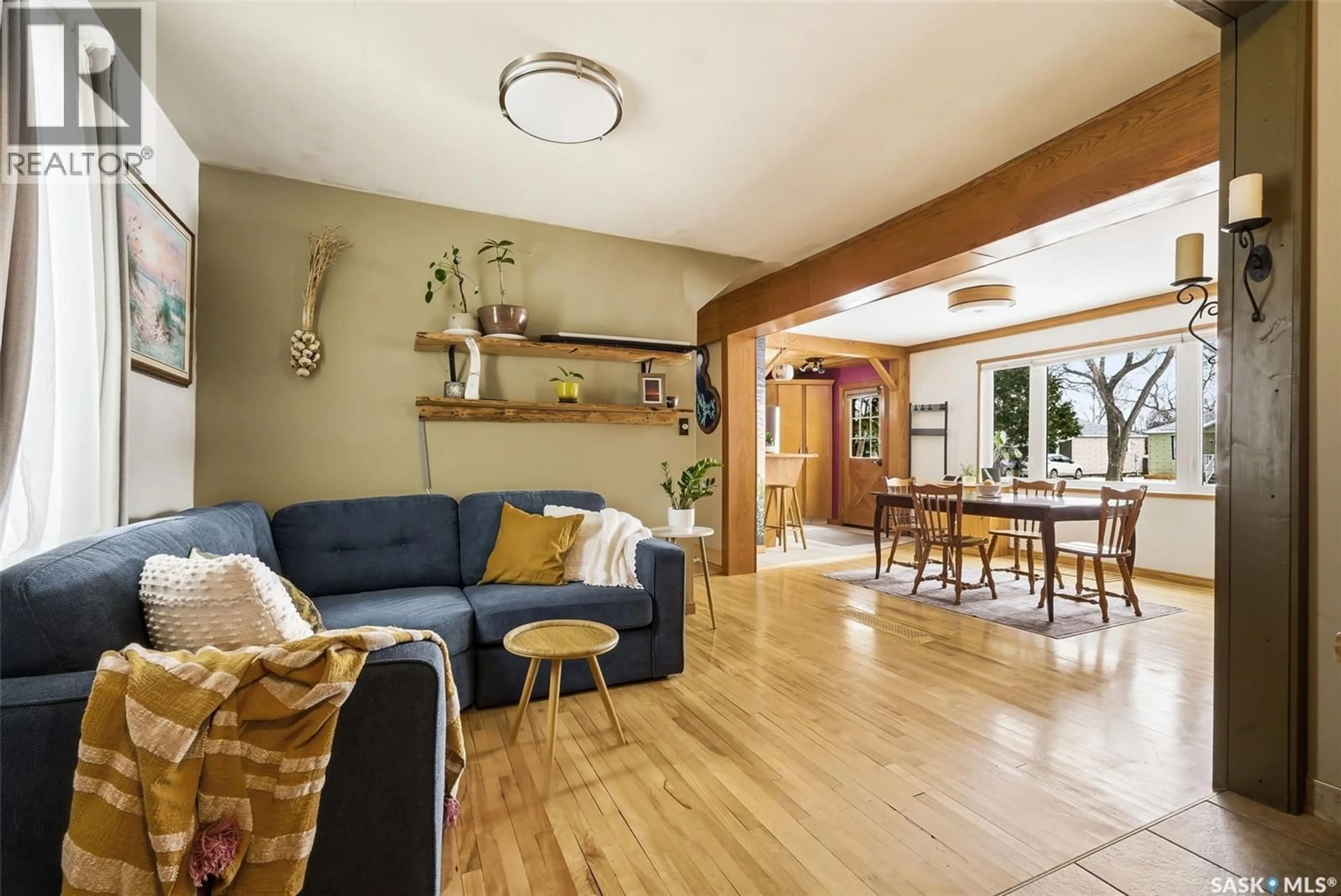 Living room with furniture, wood/laminate floor for 2612 LINDSAY STREET, Regina Saskatchewan S4N3E1