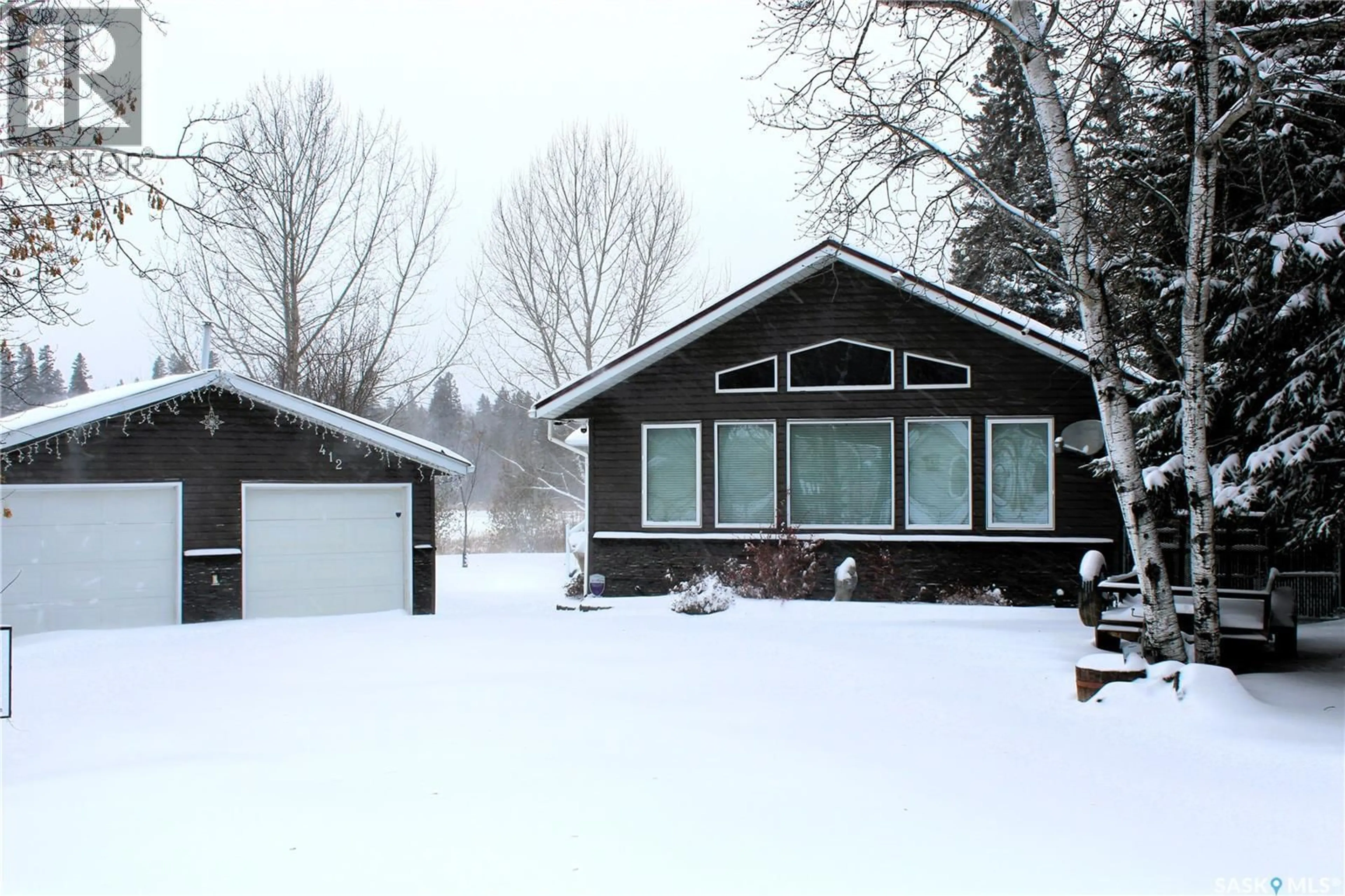 Home with vinyl exterior material, street for 412 MARY ANNE PLACE, Paddockwood Rm No. 520 Saskatchewan S0J0N0