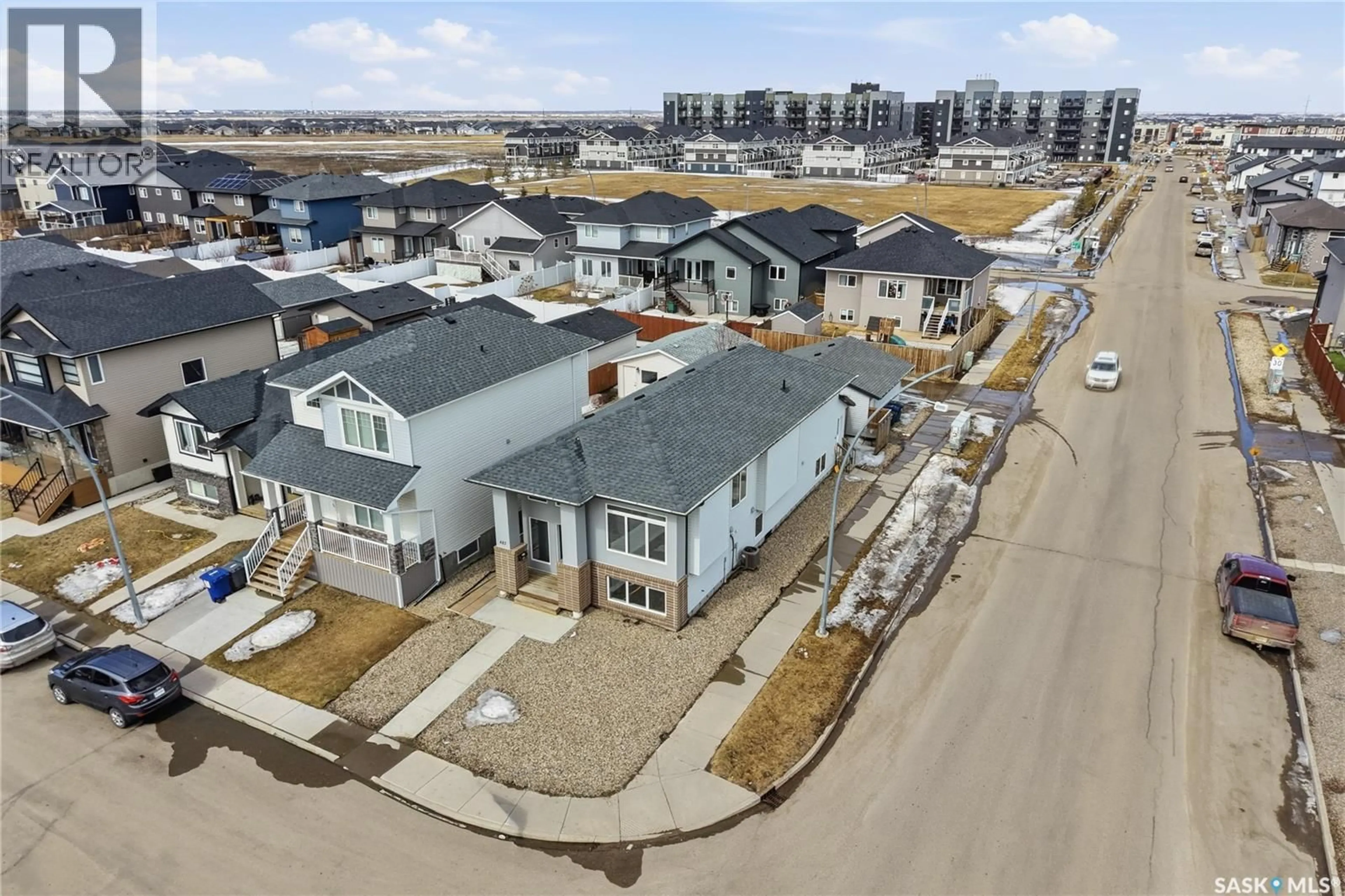 A pic from outside/outdoor area/front of a property/back of a property/a pic from drone, street for 483 BOYKOWICH STREET, Saskatoon Saskatchewan S7W0S6