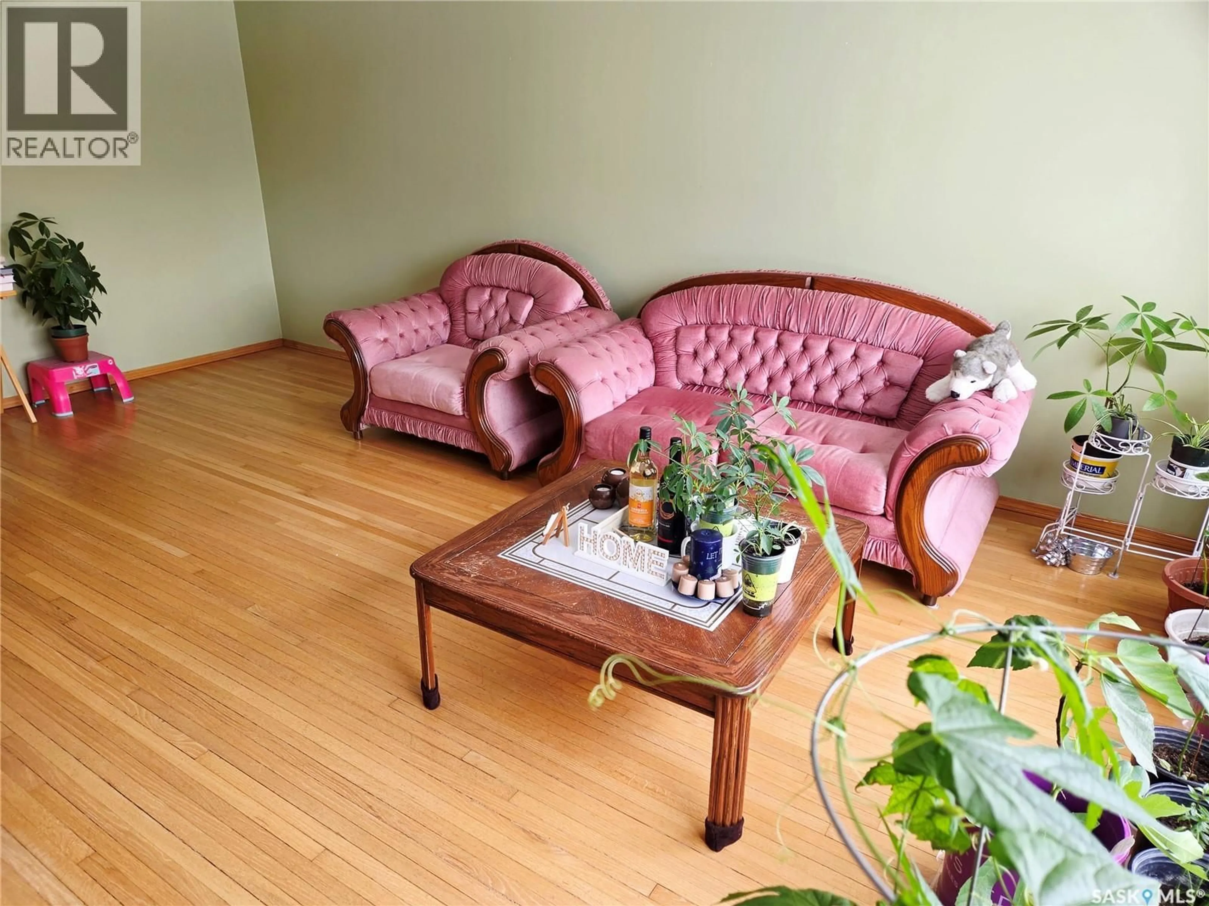 Living room with furniture, wood/laminate floor for 1147 BROADVIEW ROAD, Esterhazy Saskatchewan S0A0X0