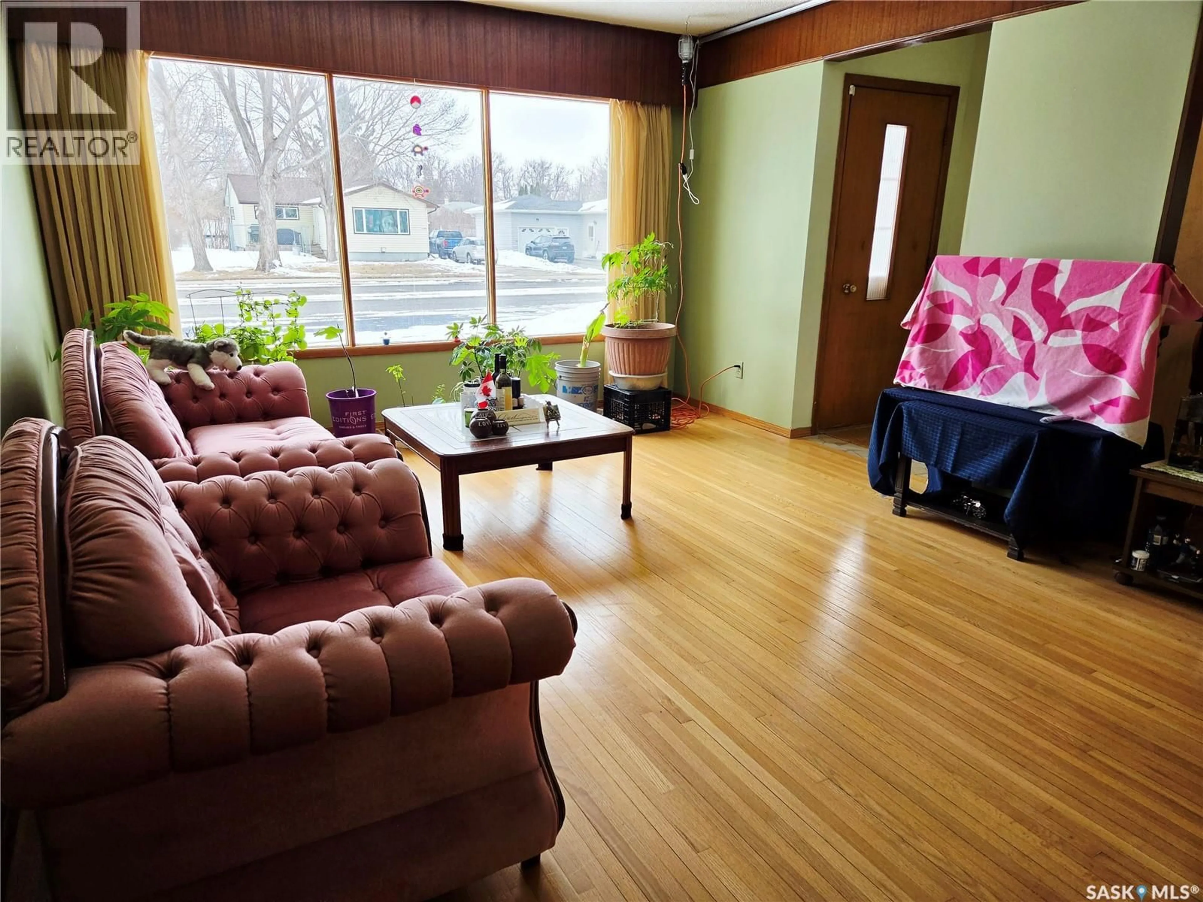 Living room with furniture, wood/laminate floor for 1147 BROADVIEW ROAD, Esterhazy Saskatchewan S0A0X0