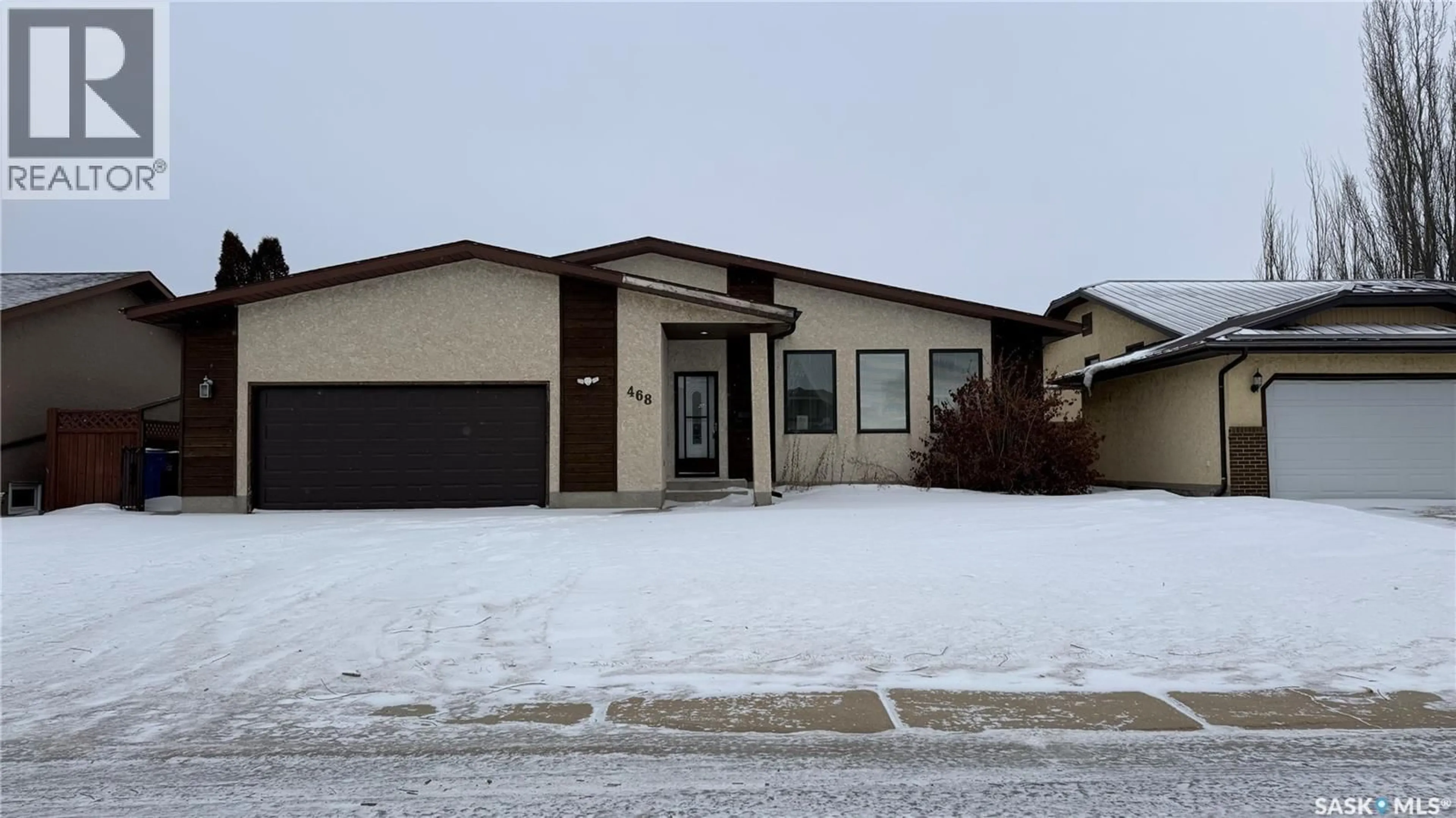 Home with vinyl exterior material, street for 468 PETTERSON DRIVE, Estevan Saskatchewan S4A2M6