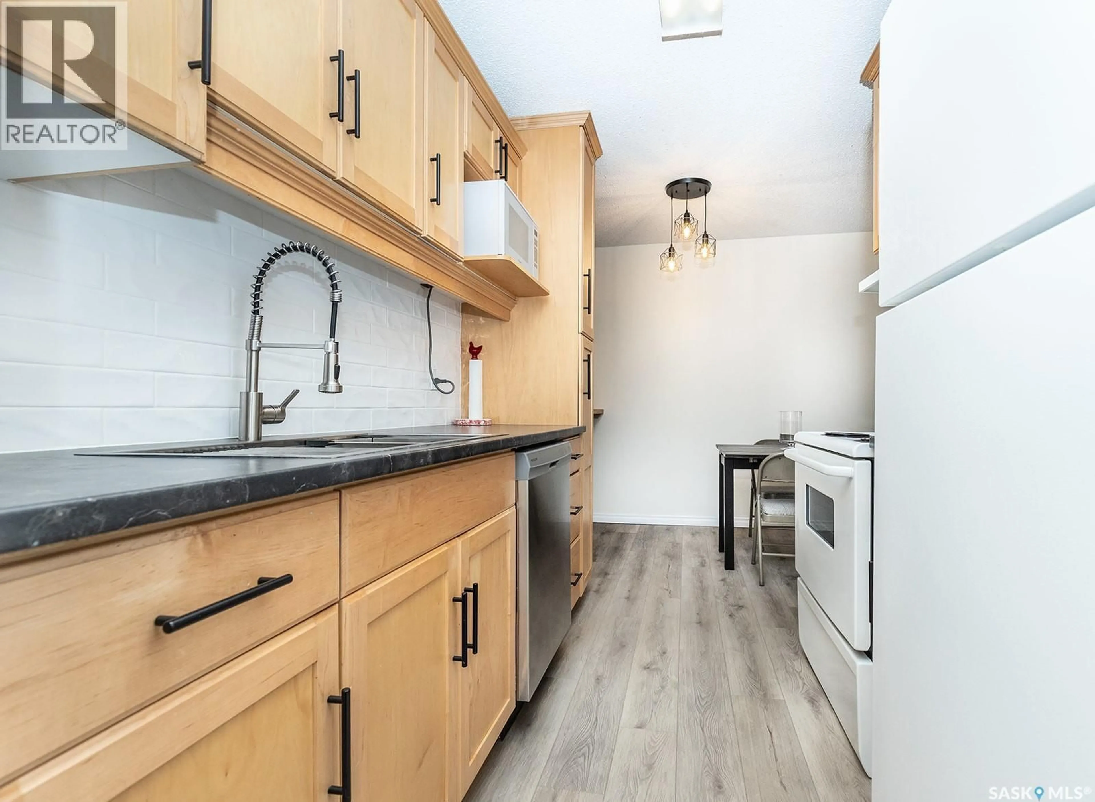 Standard kitchen, wood/laminate floor for 310 - 231 STILLWATER DRIVE, Saskatoon Saskatchewan S7J4H7