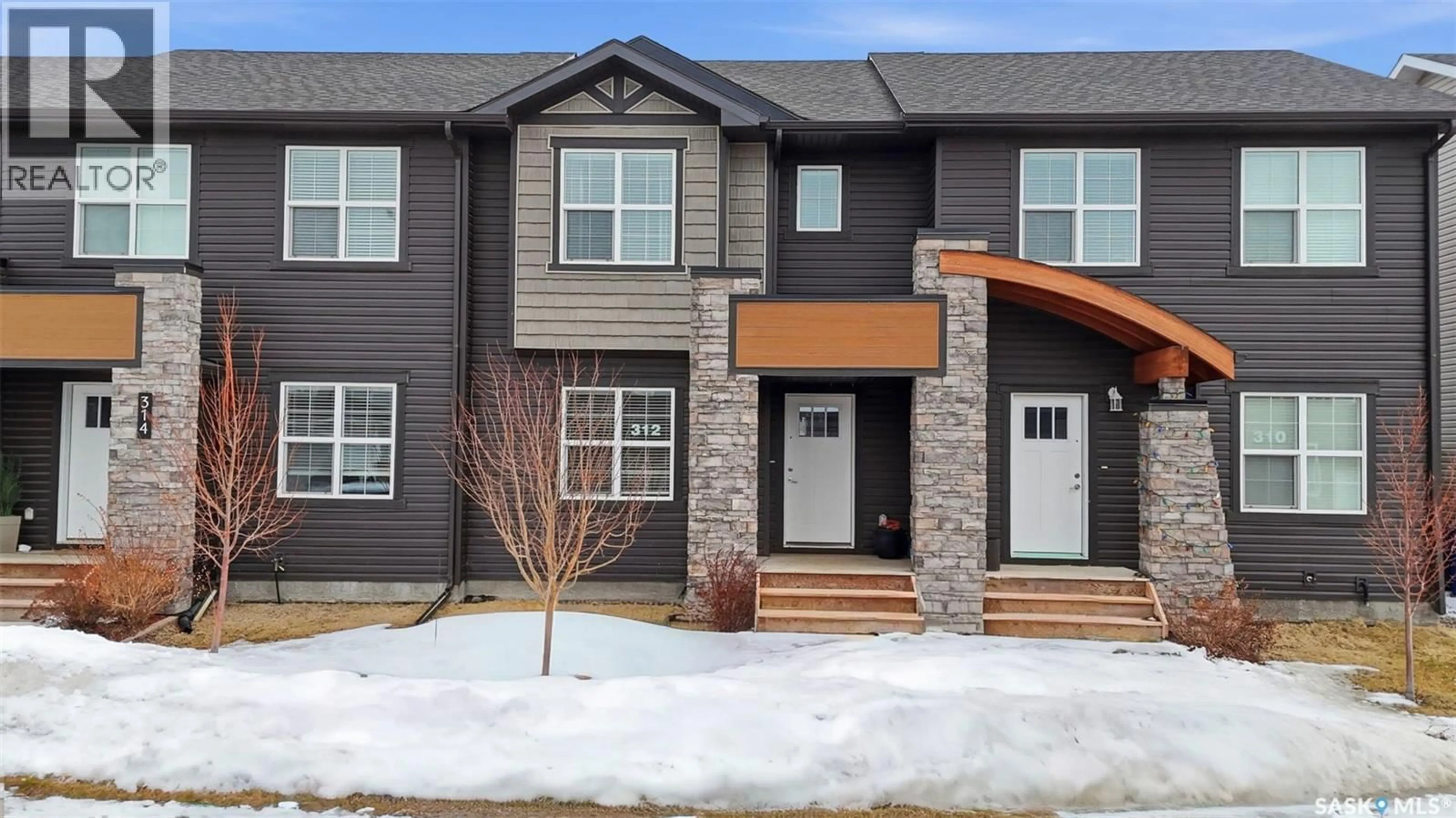 Home with brick exterior material, street for 312 UNDERHILL BEND, Saskatoon Saskatchewan S7V0V4