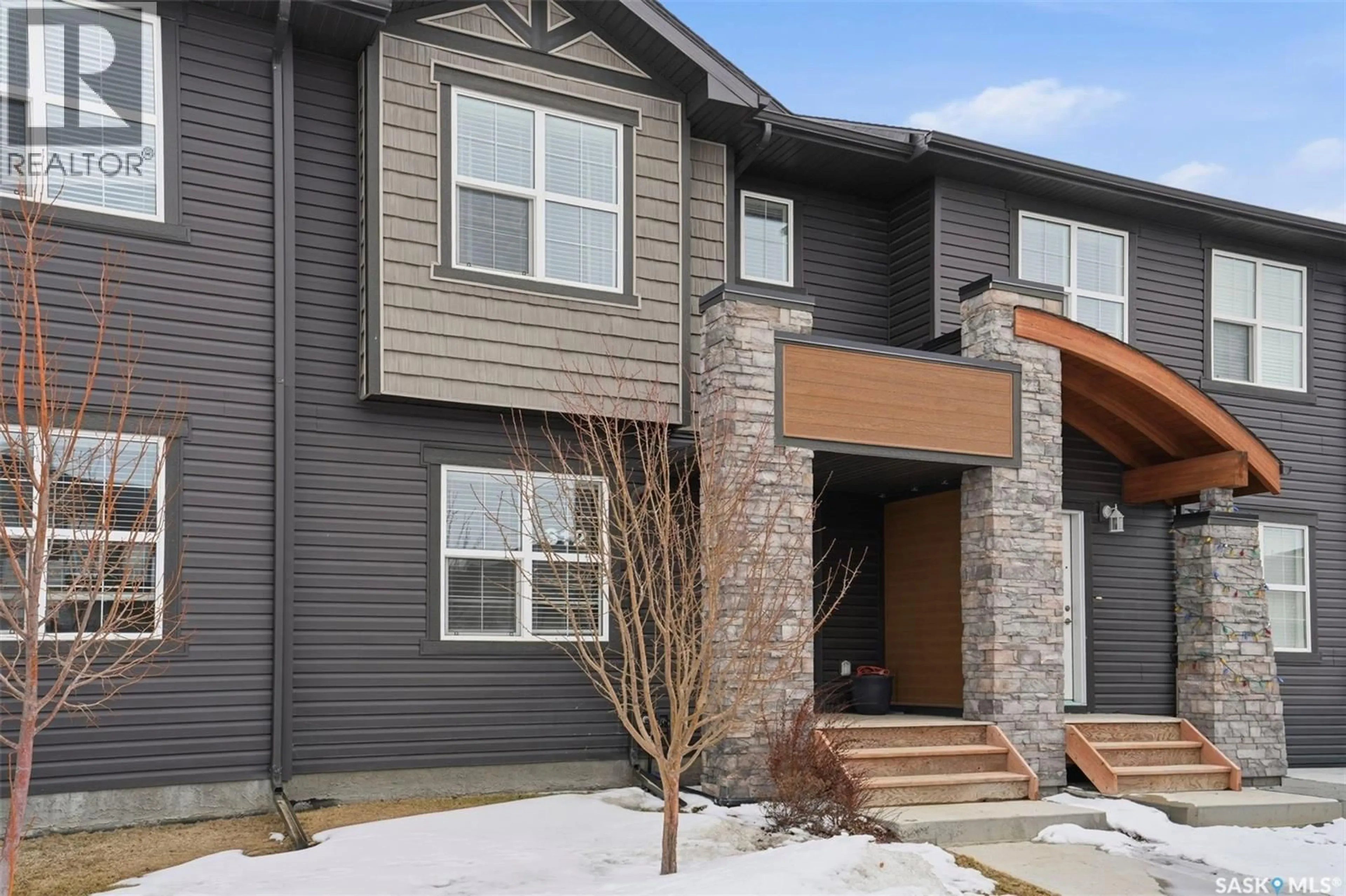 Home with brick exterior material, street for 312 UNDERHILL BEND, Saskatoon Saskatchewan S7V0V4