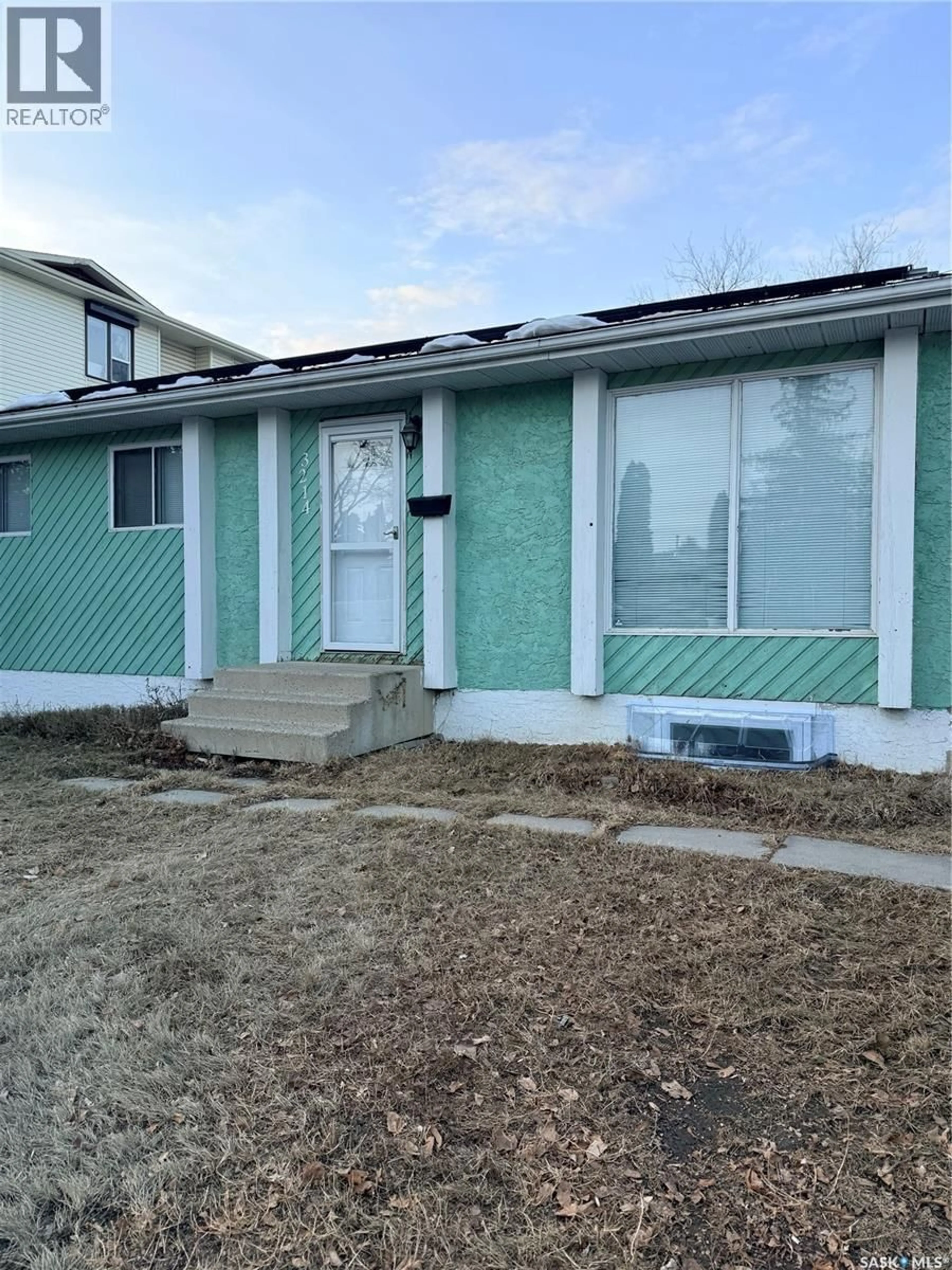 Home with vinyl exterior material, street for 3214 33RD STREET, Saskatoon Saskatchewan S7L6K3