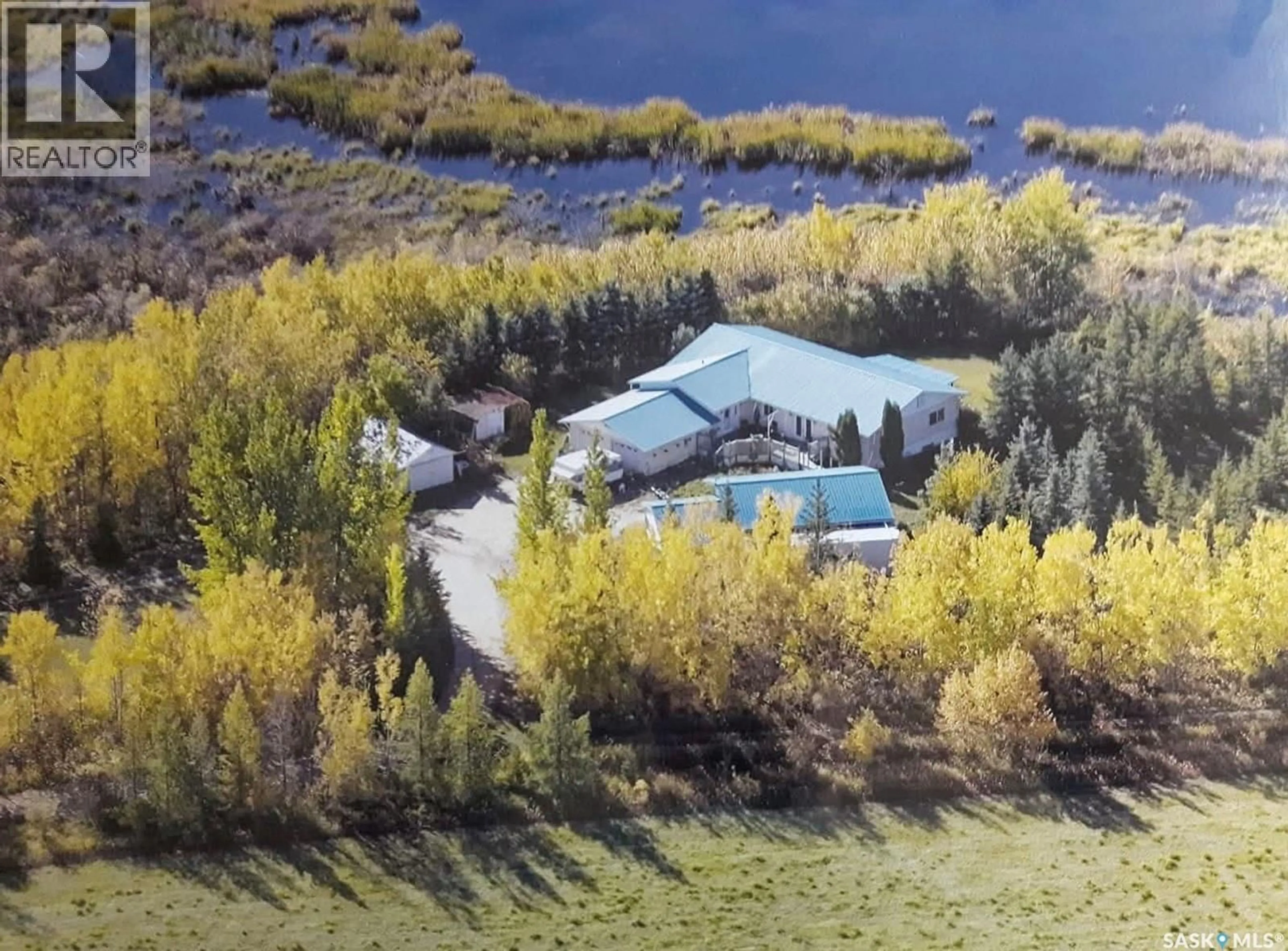 A pic from outside/outdoor area/front of a property/back of a property/a pic from drone, water/lake/river/ocean view for CABANA WATERFRONT, Meadow Lake Rm No.588 Saskatchewan S9X1Y6