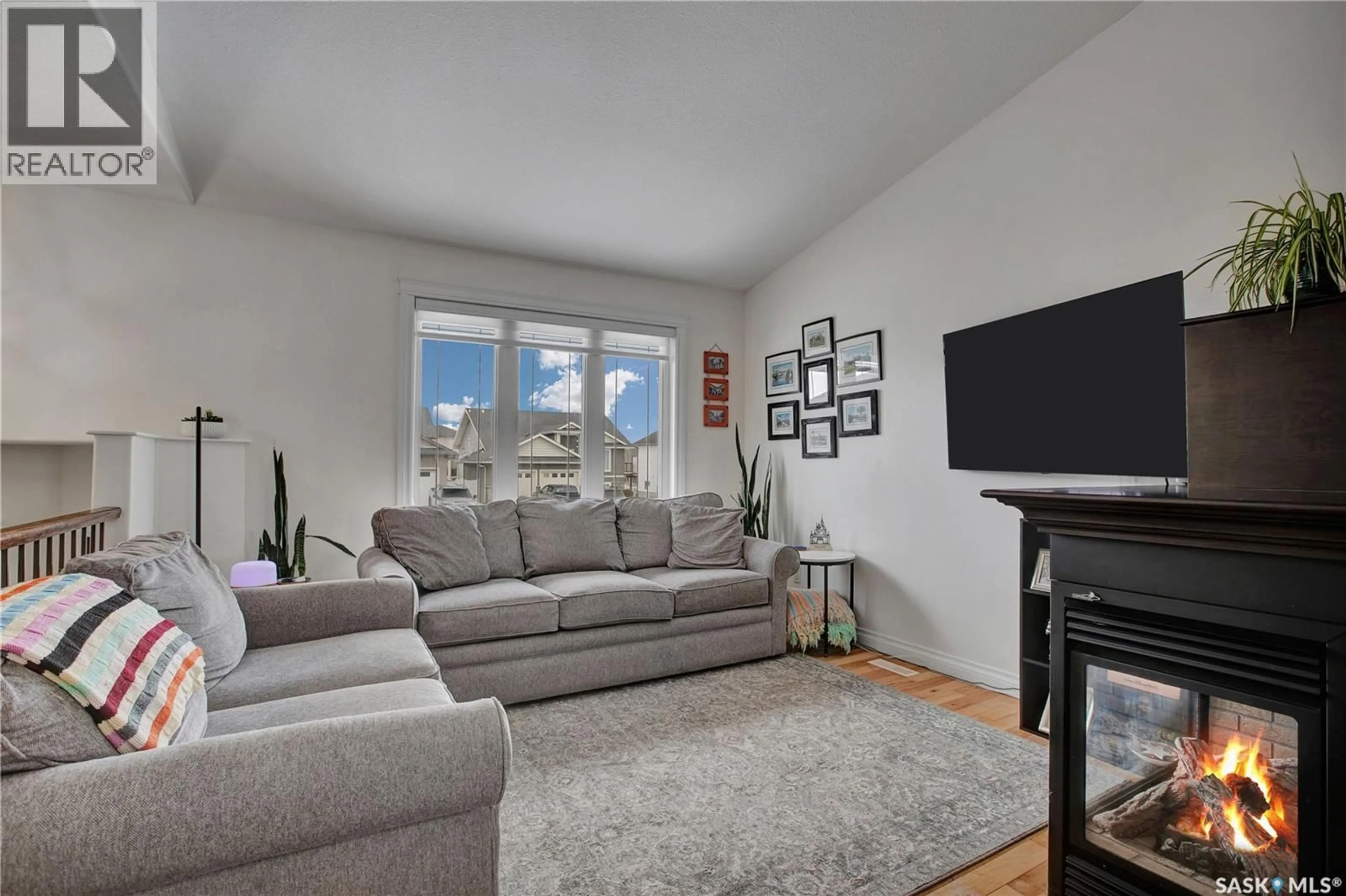 Living room with furniture, unknown for 704 REIMER ROAD, Martensville Saskatchewan S0K0A2