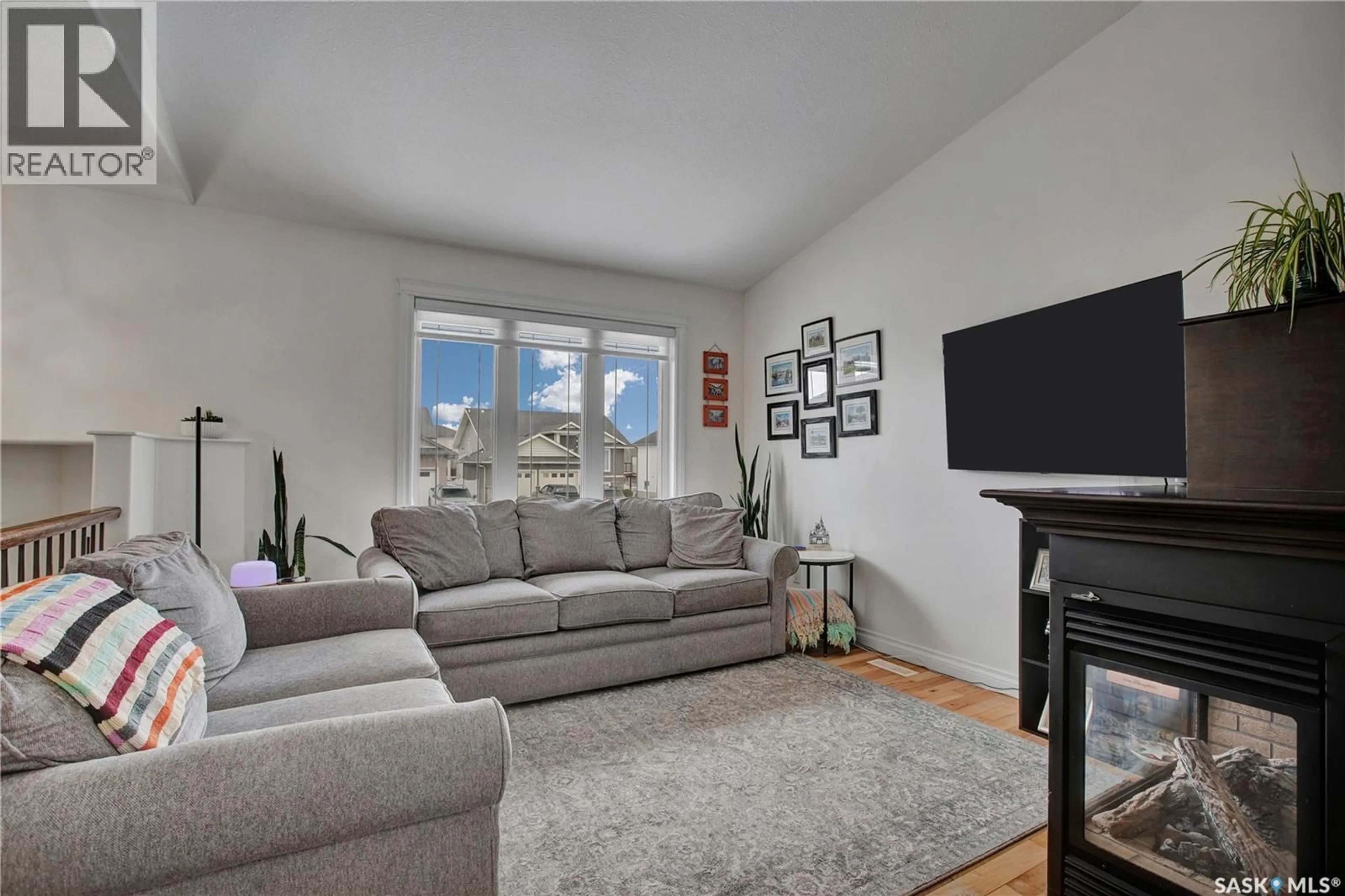 Living room with furniture, unknown for 704 REIMER ROAD, Martensville Saskatchewan S0K0A2