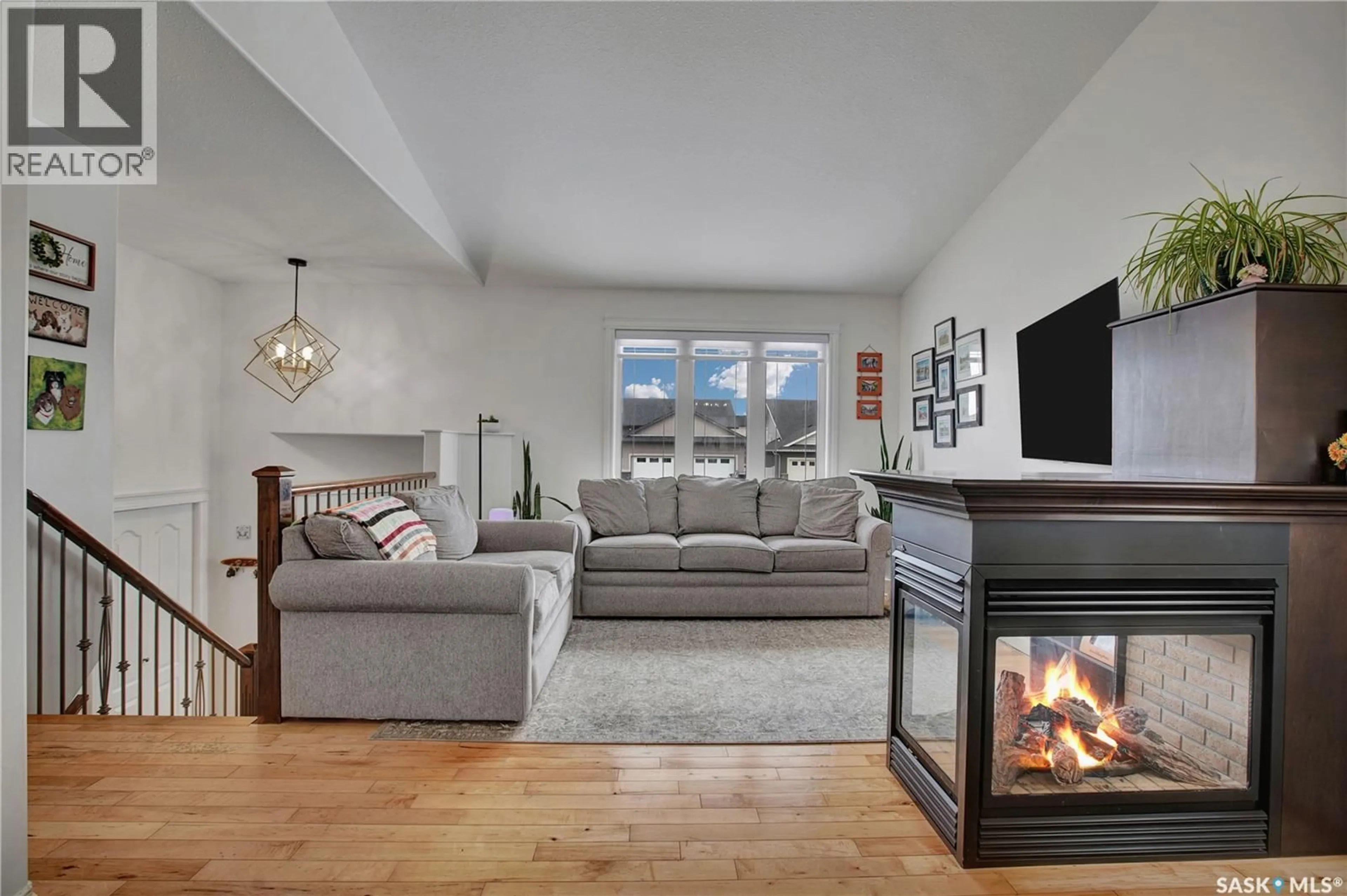 Living room with furniture, unknown for 704 REIMER ROAD, Martensville Saskatchewan S0K0A2