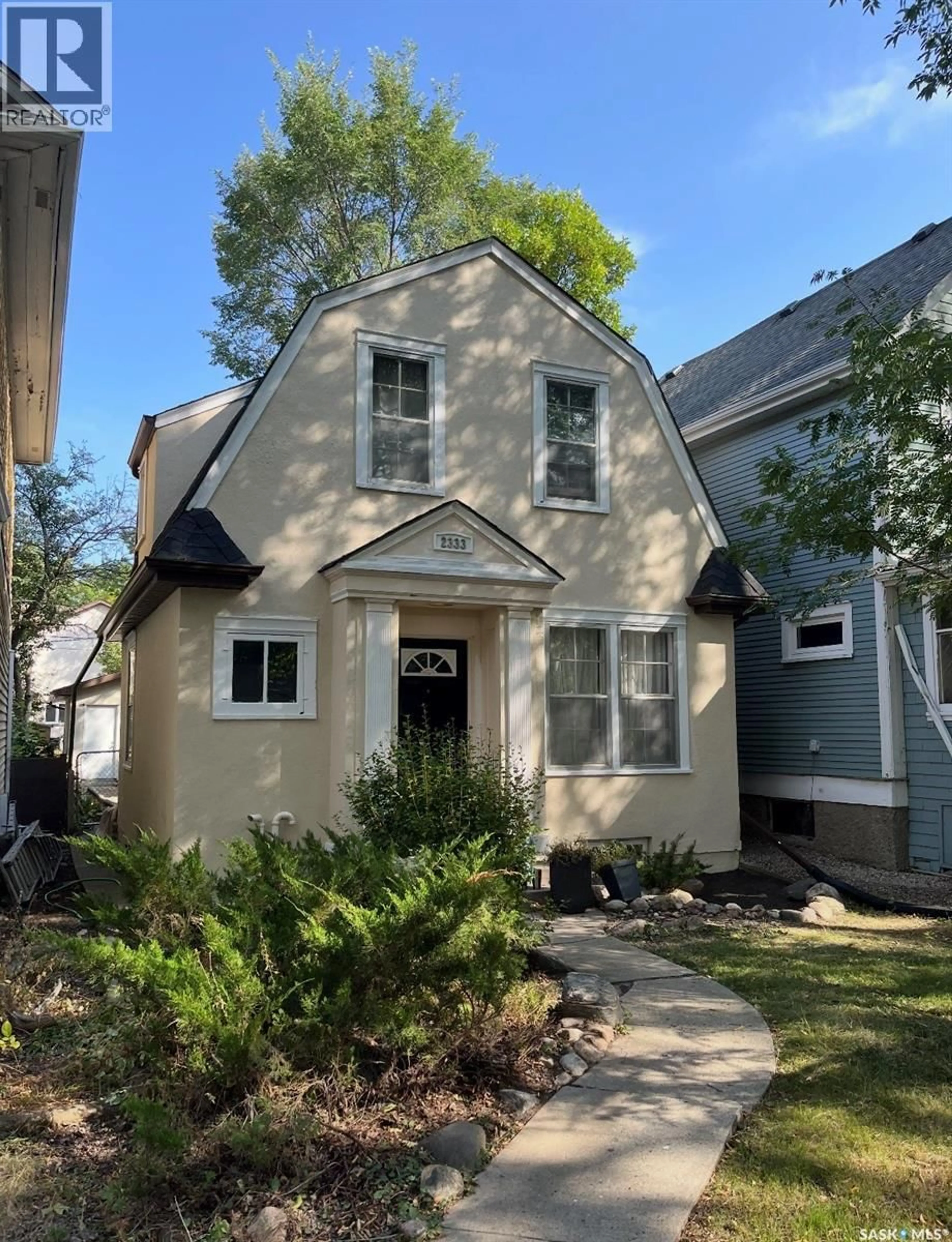 Home with vinyl exterior material, street for 2333 ROBINSON STREET, Regina Saskatchewan S4T2R3