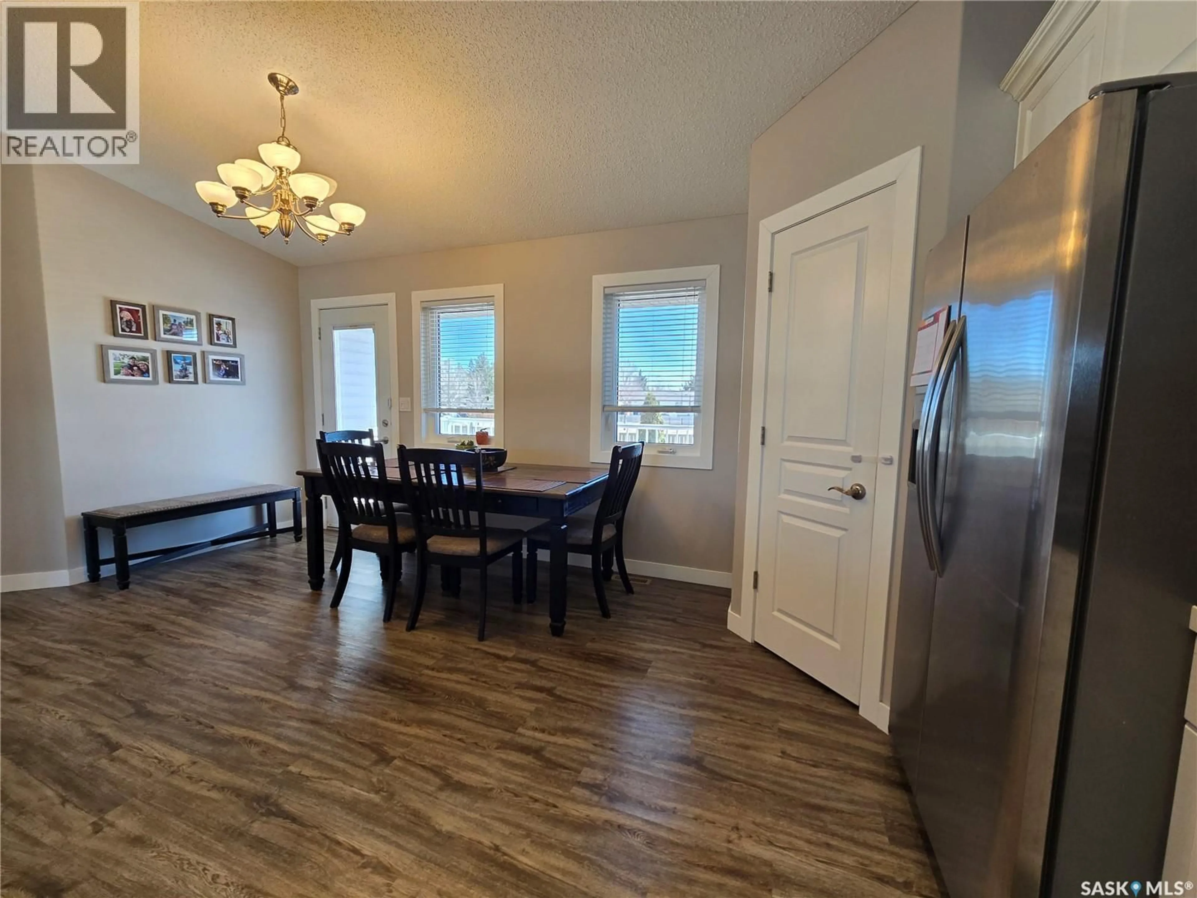 Dining room, wood/laminate floor for 752 MCTAGGART DRIVE, Weyburn Saskatchewan S4H3M6