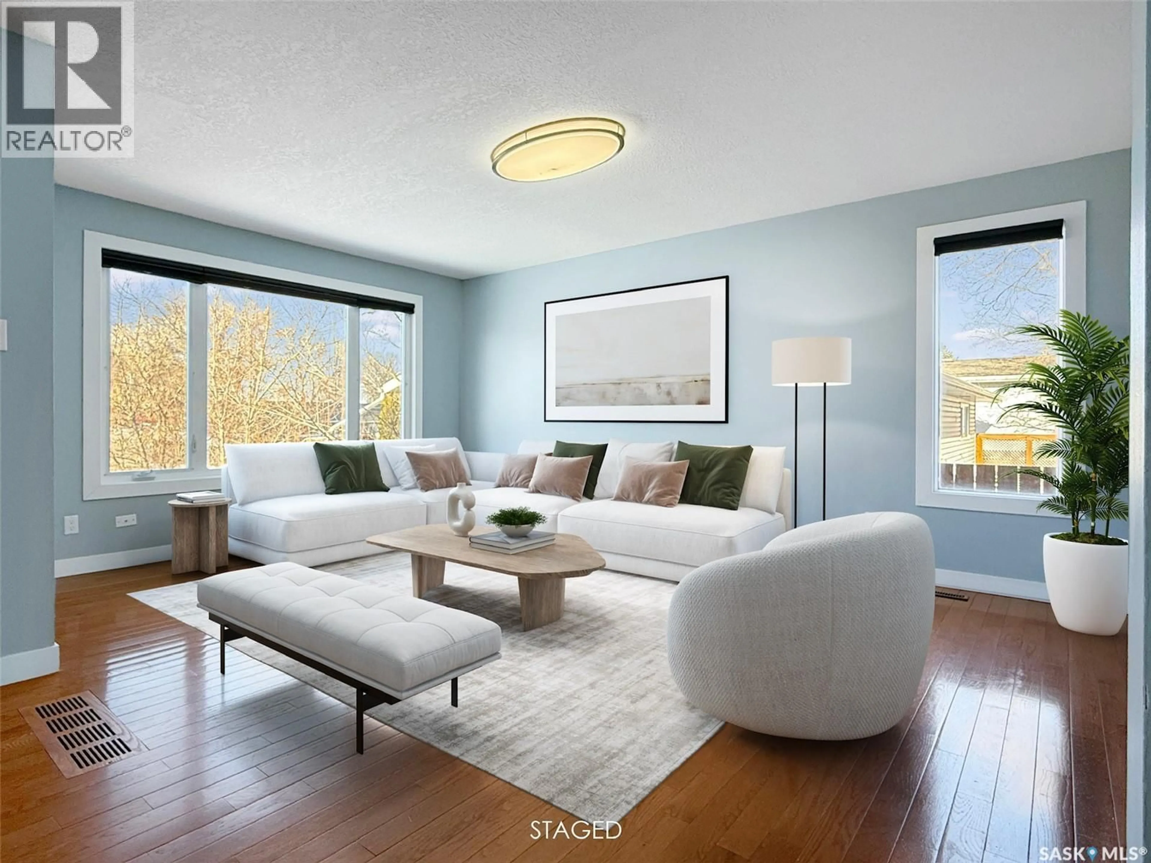 Living room with furniture, wood/laminate floor for 210 CLINTON PLACE, Swift Current Saskatchewan S9H4K2