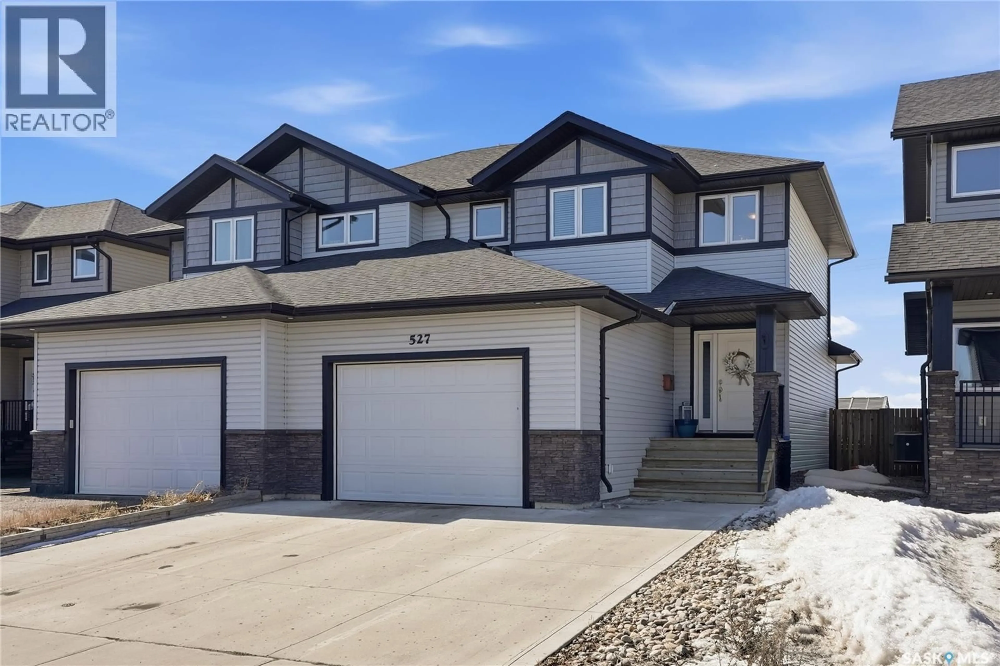 Home with vinyl exterior material, street for 527 MAPLE CRESCENT, Warman Saskatchewan S0K4S2