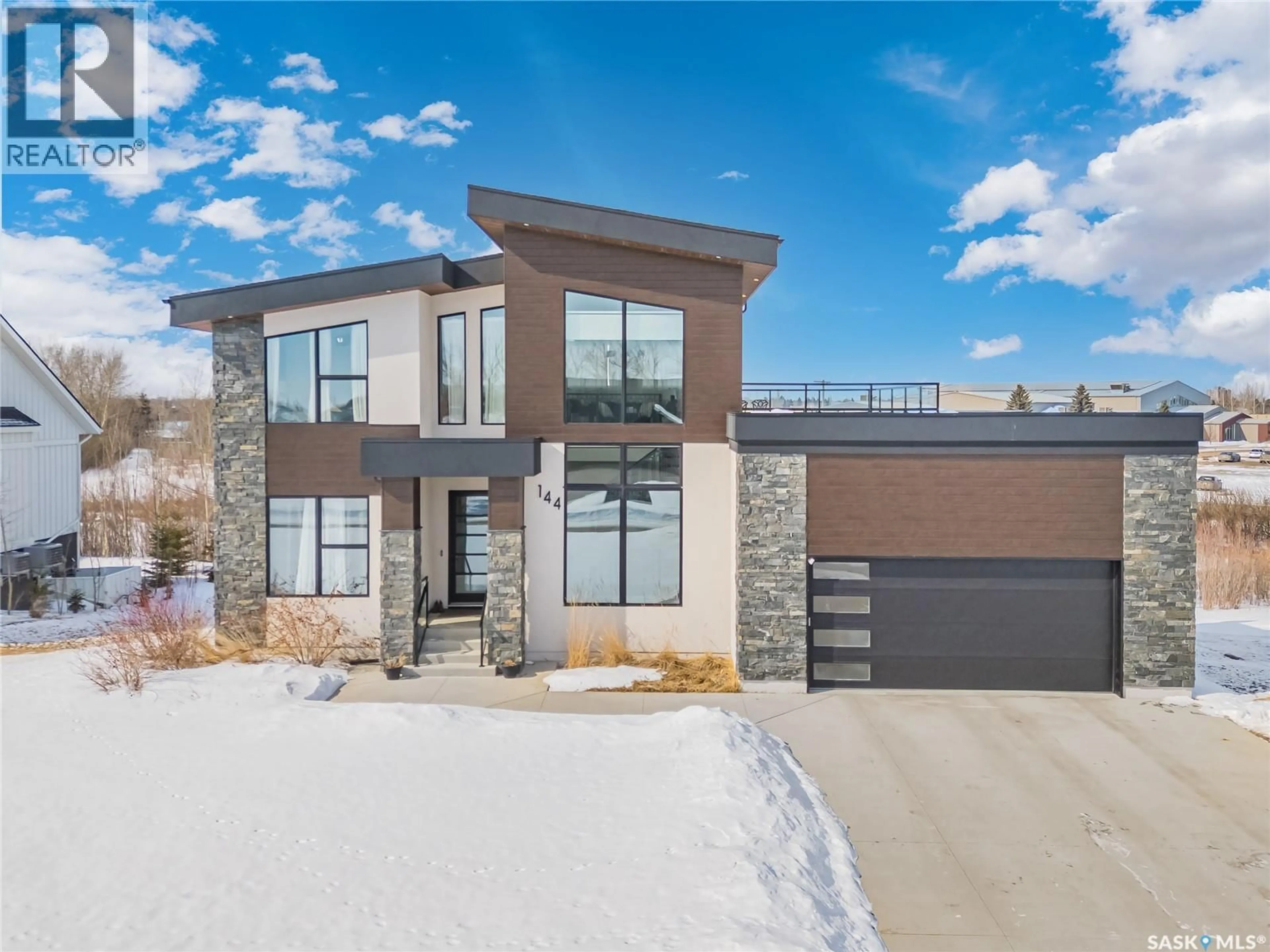 Home with brick exterior material, street for 144 GREENBRYRE STREET, Corman Park Rm No. 344 Saskatchewan S7V0J6