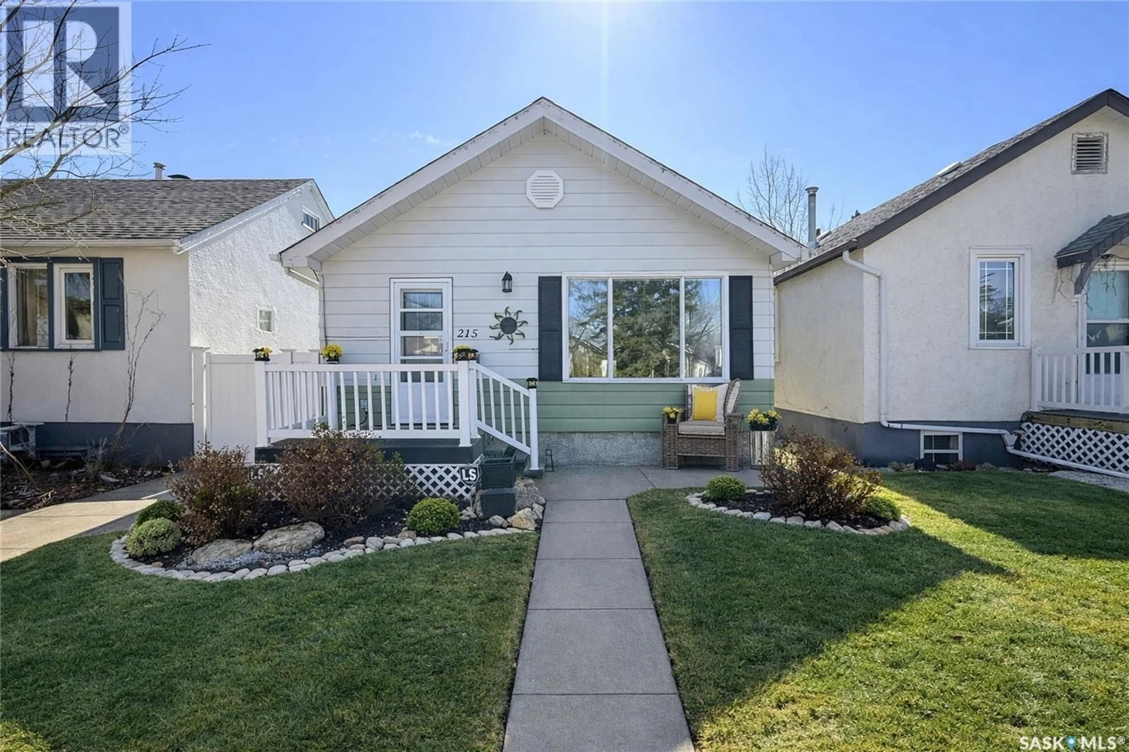 Home with vinyl exterior material, street for 215 COLLEGE AVENUE, Regina Saskatchewan S4N0W7