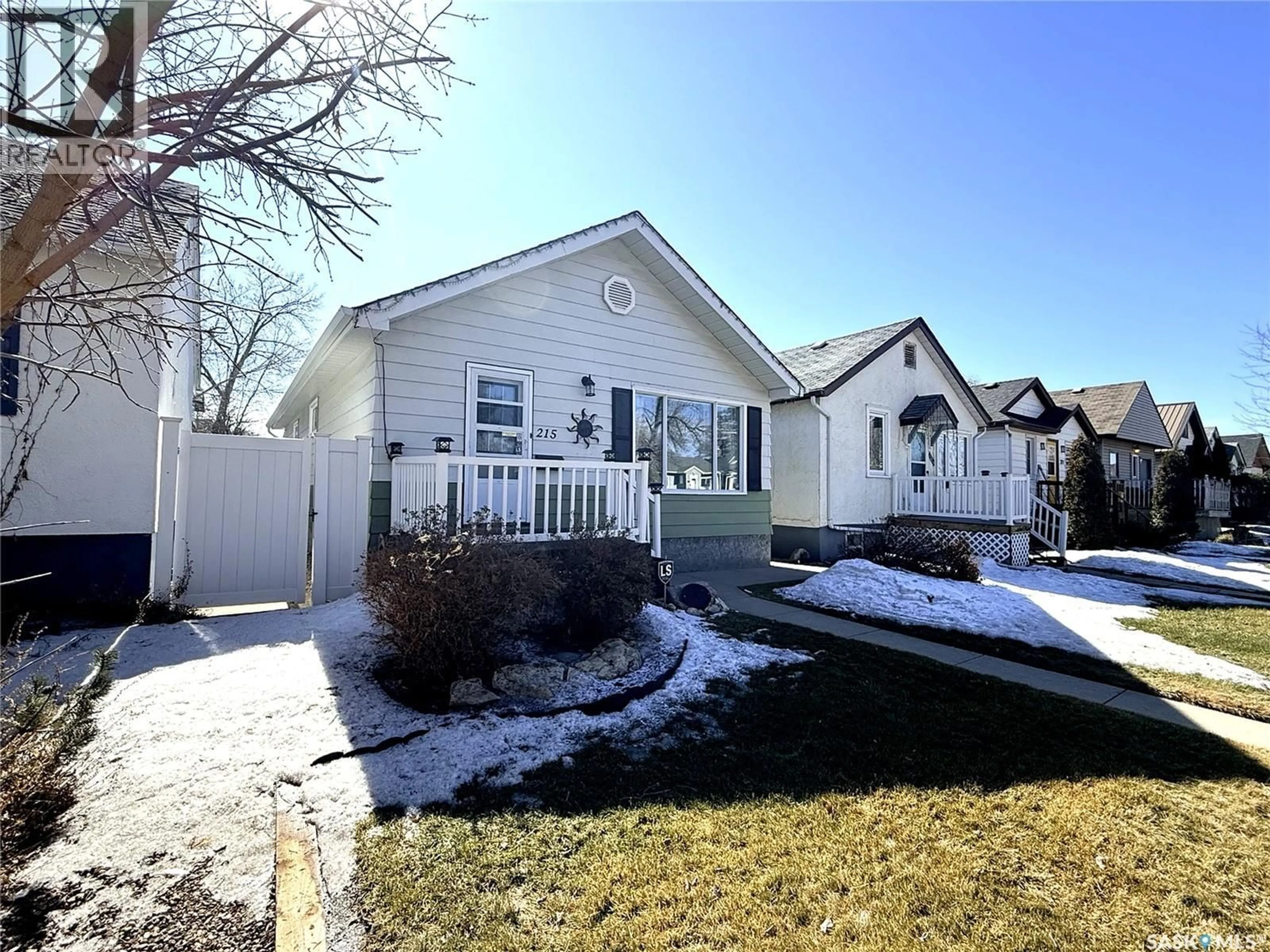 Home with vinyl exterior material, street for 215 COLLEGE AVENUE, Regina Saskatchewan S4N0W7