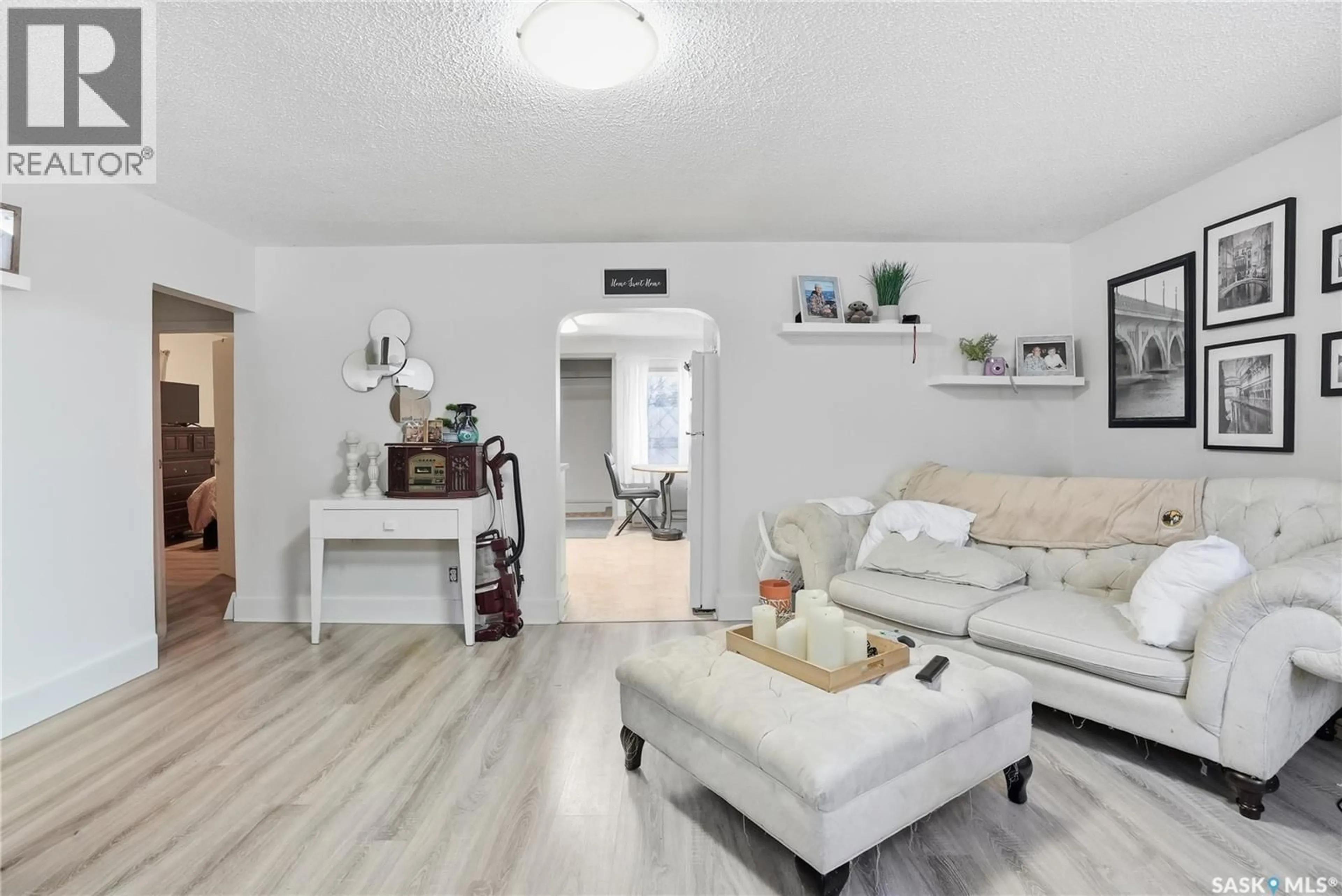 Living room with furniture, wood/laminate floor for 108 DUNLOP STREET, Saskatoon Saskatchewan S7N2B5