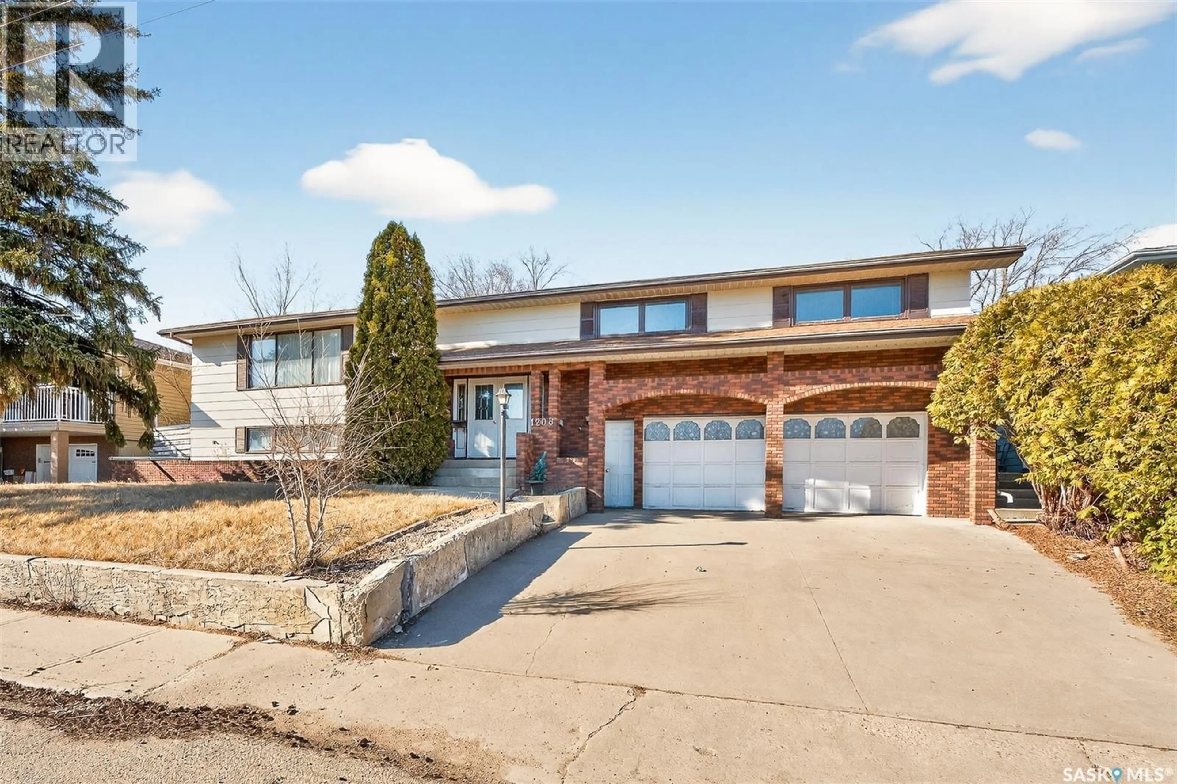 Home with brick exterior material, street for 1208 ATHABASCA STREET, Moose Jaw Saskatchewan S6H6C6