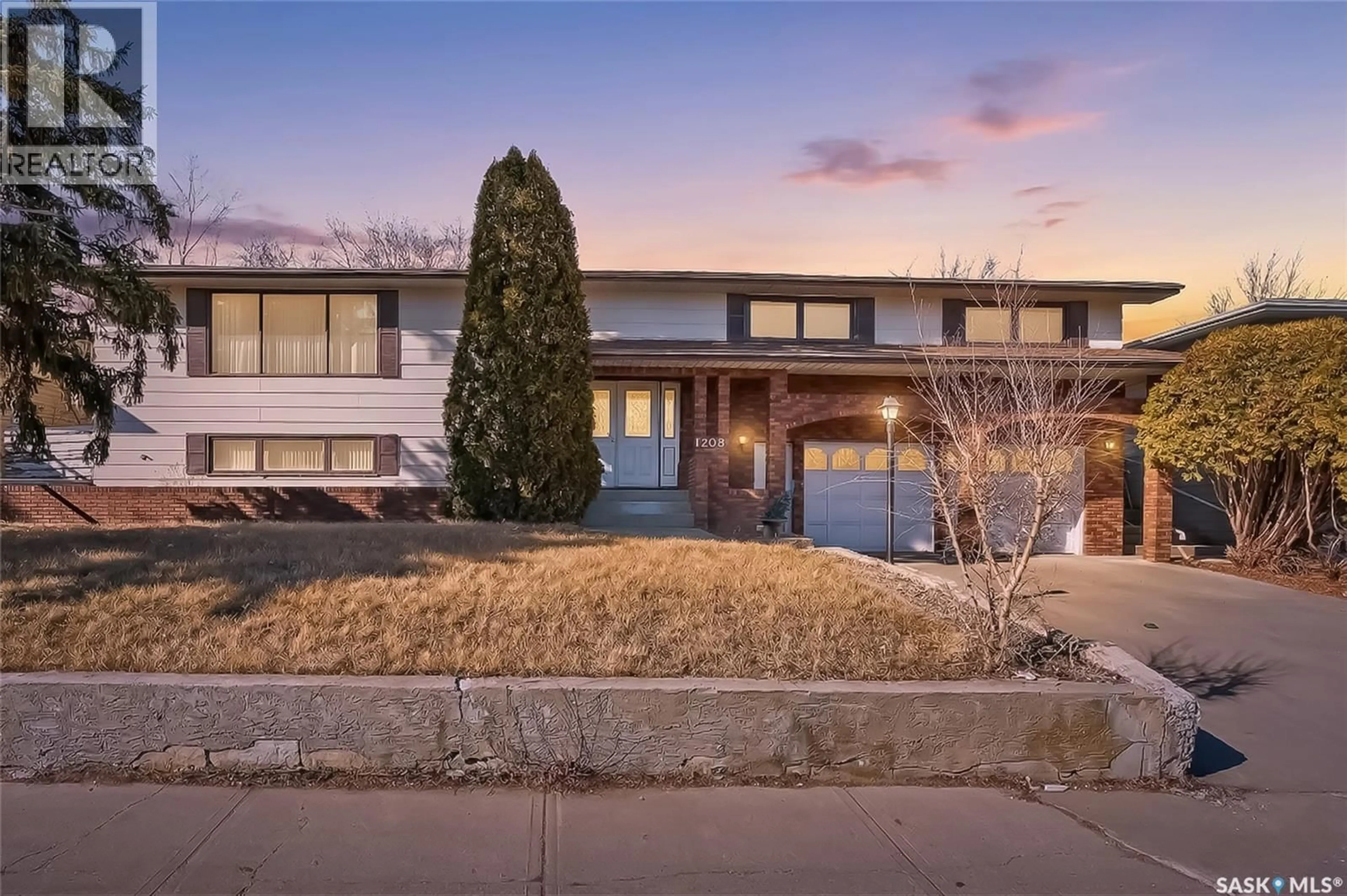 Home with brick exterior material, street for 1208 ATHABASCA STREET, Moose Jaw Saskatchewan S6H6C6