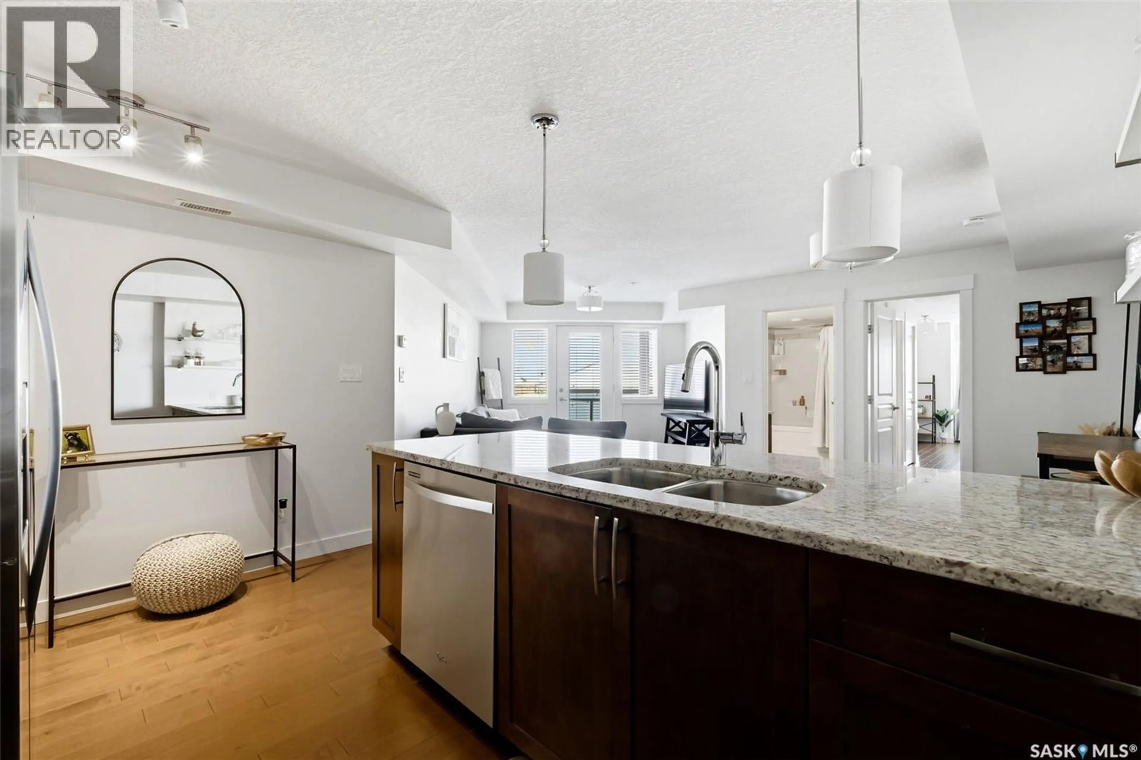 Open concept kitchen, ceramic/tile floor for 5301 - 312 UNIVERSAL CRESCENT, Regina Saskatchewan S4W0L2