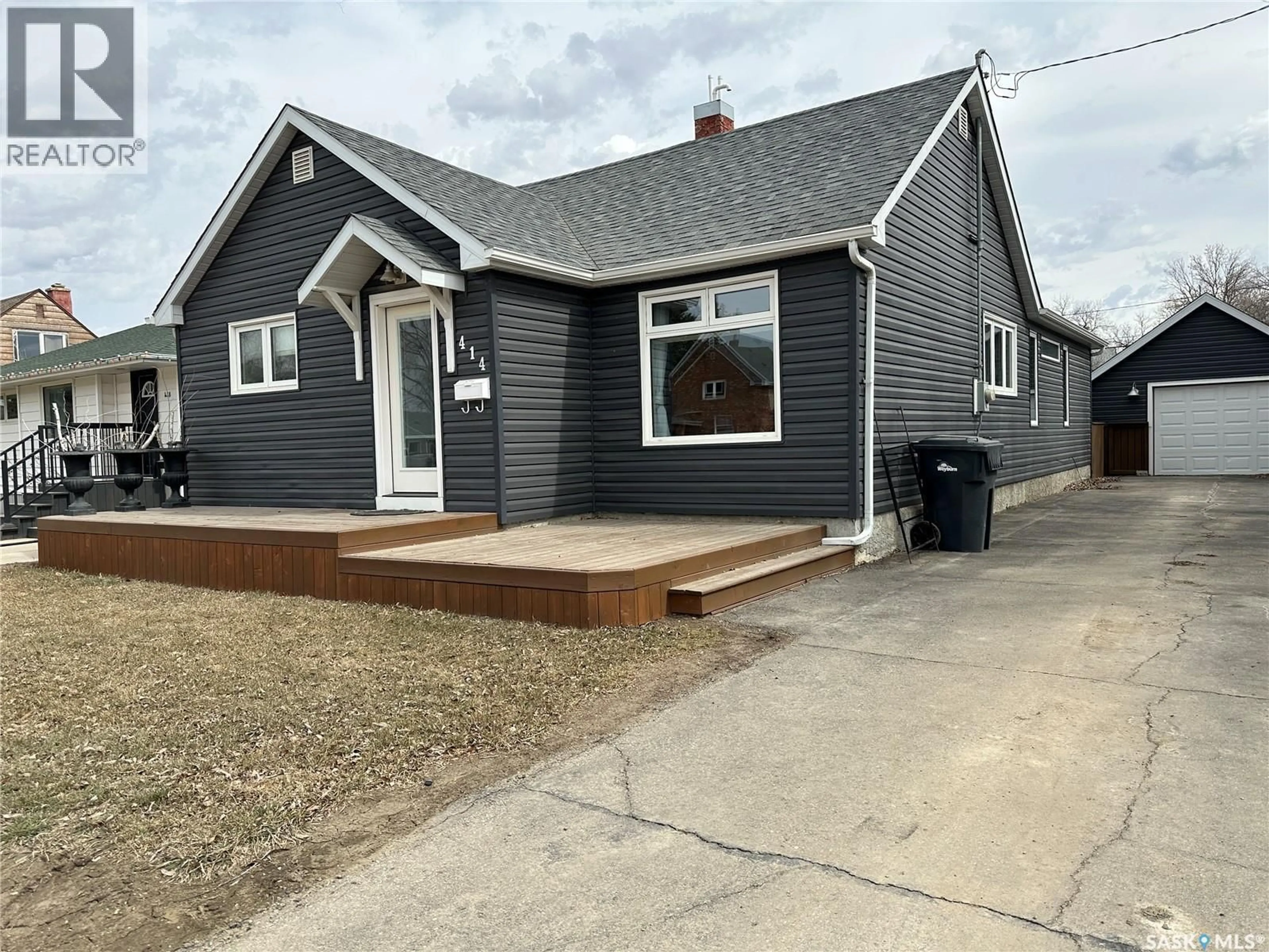 Home with vinyl exterior material, street for 414 GOVERNMENT ROAD, Weyburn Saskatchewan S4H0P6