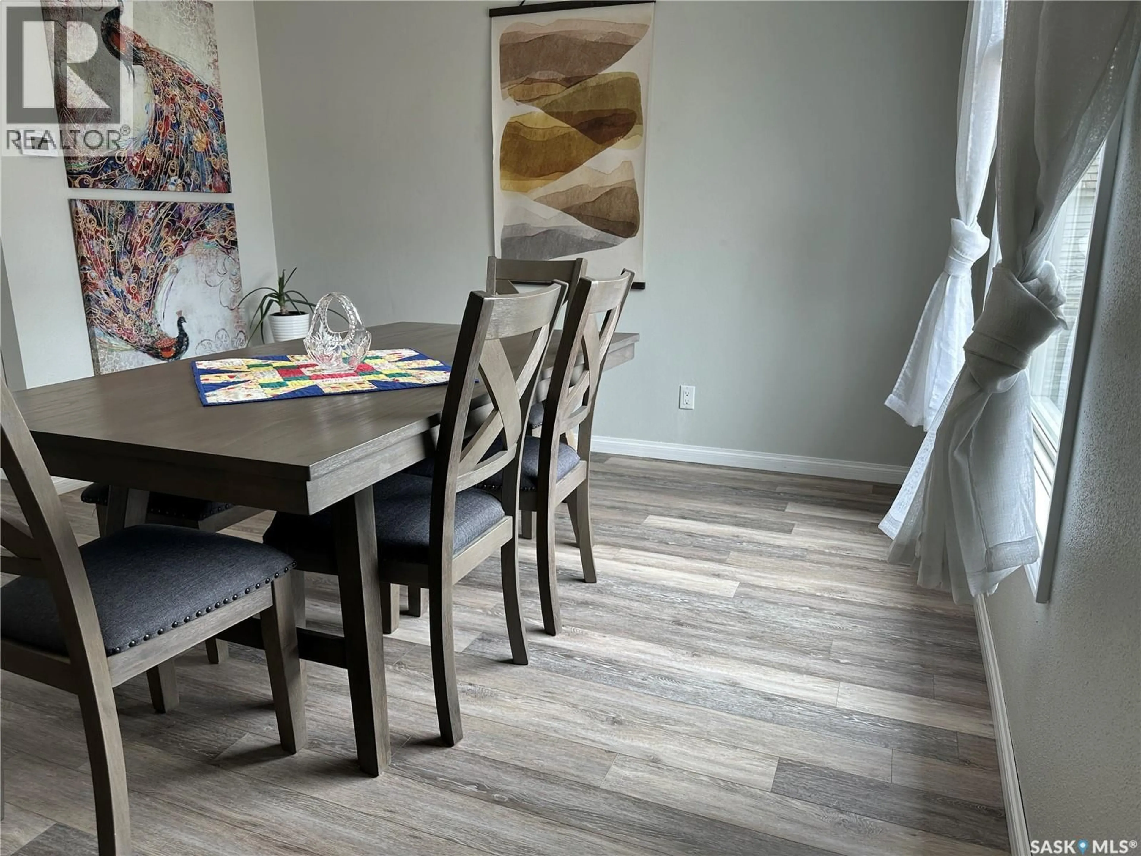 Dining room, wood/laminate floor for 414 GOVERNMENT ROAD, Weyburn Saskatchewan S4H0P6