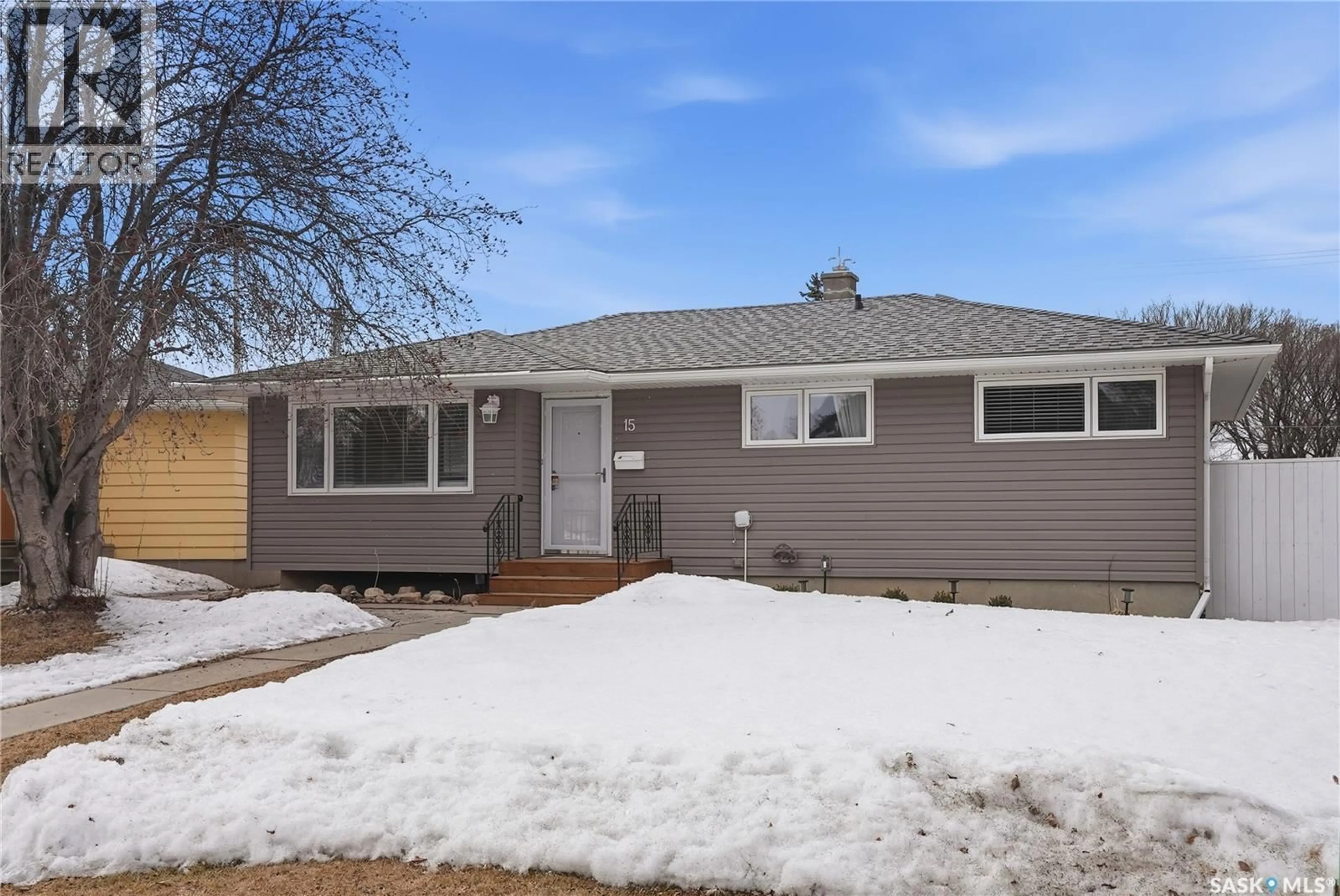 Home with vinyl exterior material, street for 15 STEWART AVENUE, Saskatoon Saskatchewan S7L3S5