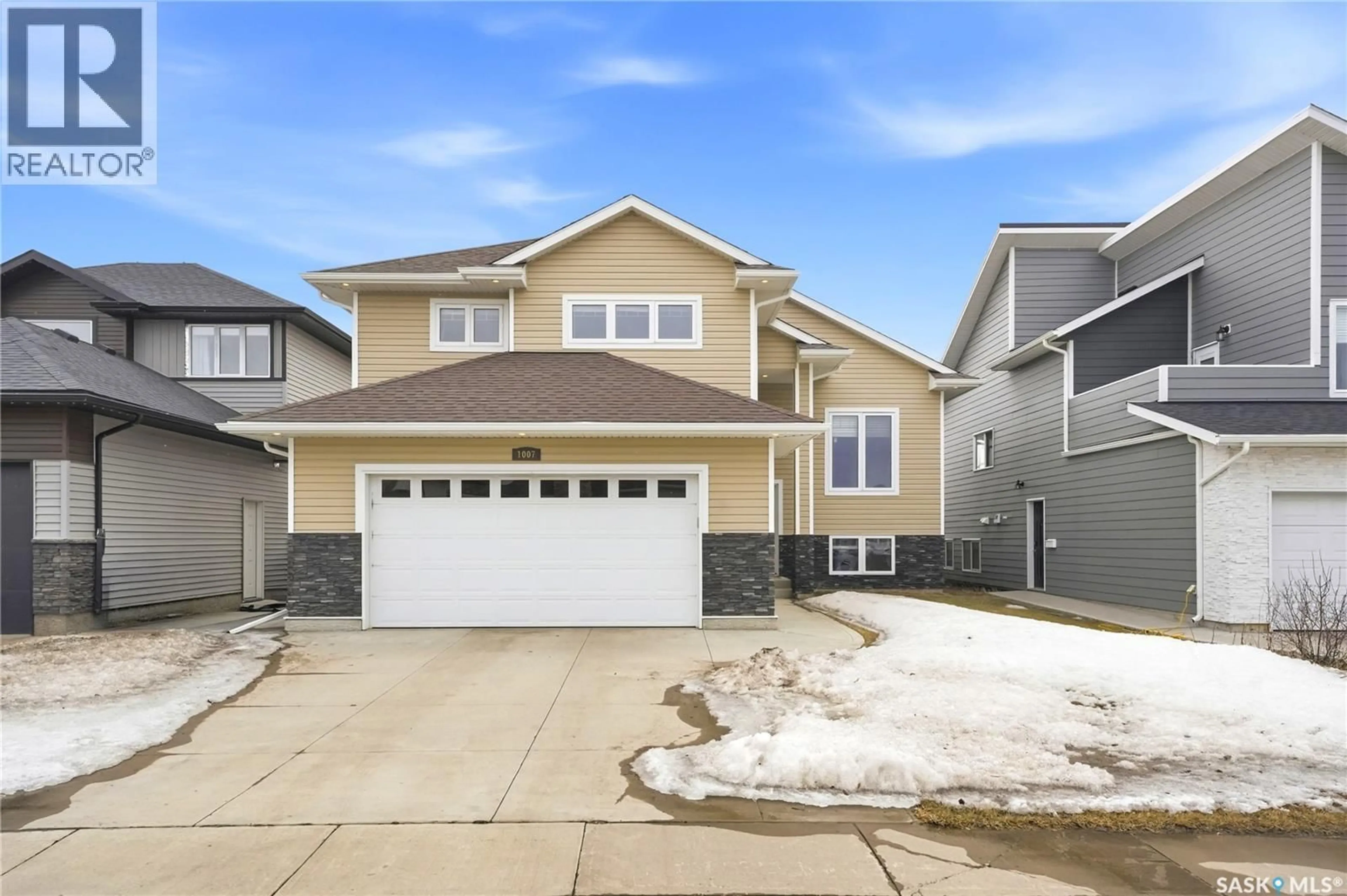 Home with vinyl exterior material, street for 1007 GLACIAL SHORES COMMON, Saskatoon Saskatchewan S7S1N1