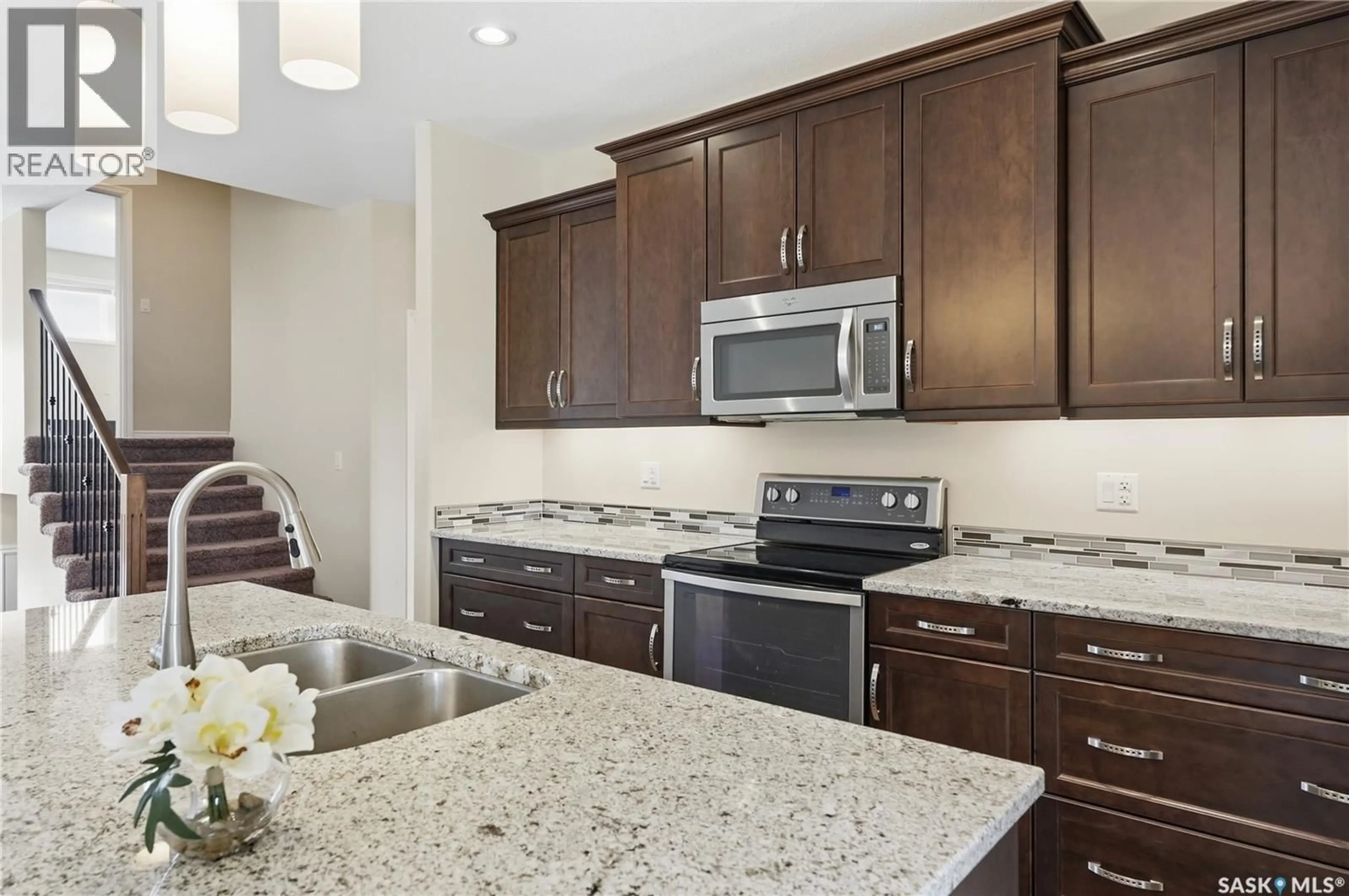 Open concept kitchen, ceramic/tile floor for 1007 GLACIAL SHORES COMMON, Saskatoon Saskatchewan S7S1N1