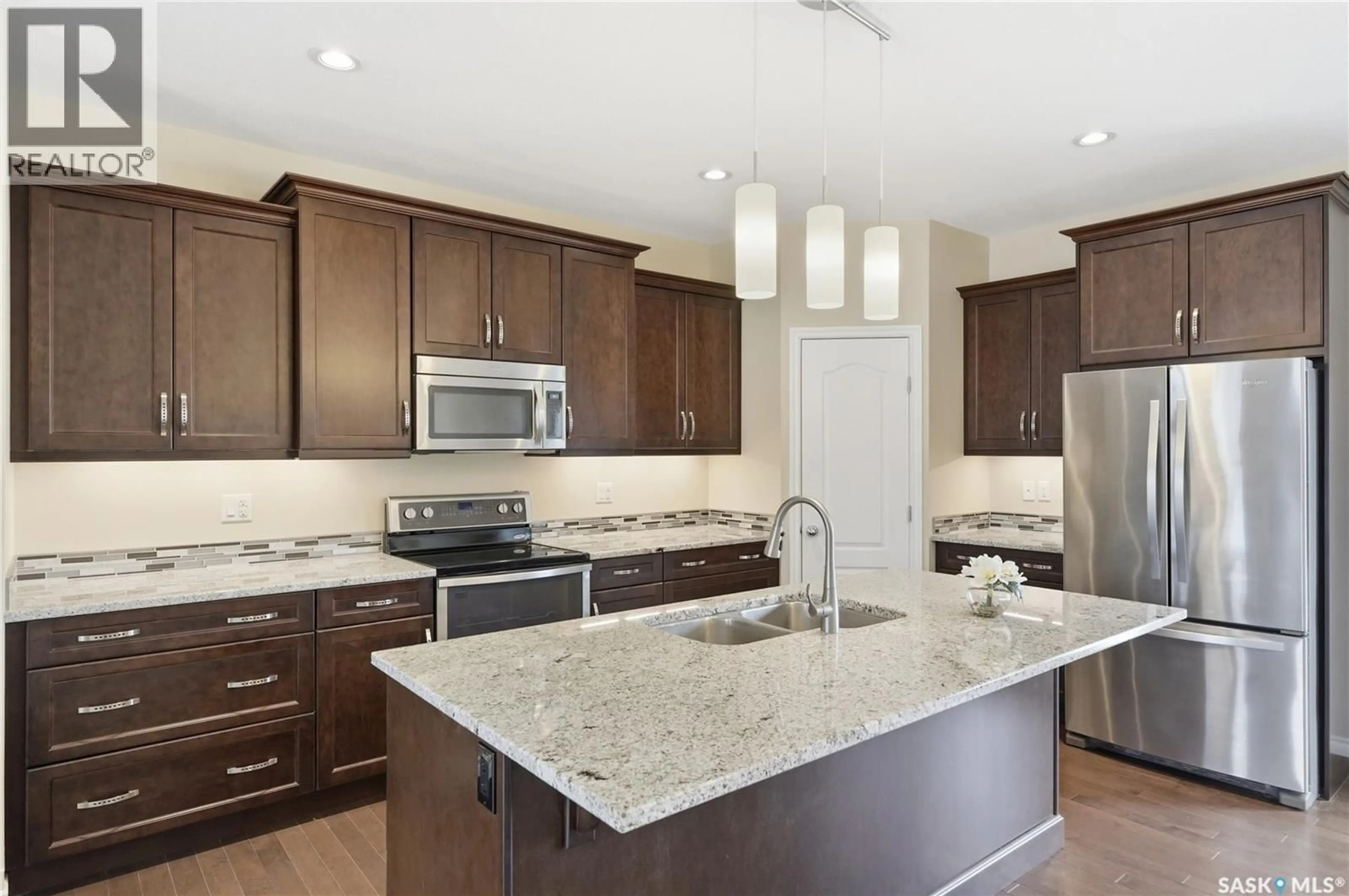 Open concept kitchen, ceramic/tile floor for 1007 GLACIAL SHORES COMMON, Saskatoon Saskatchewan S7S1N1