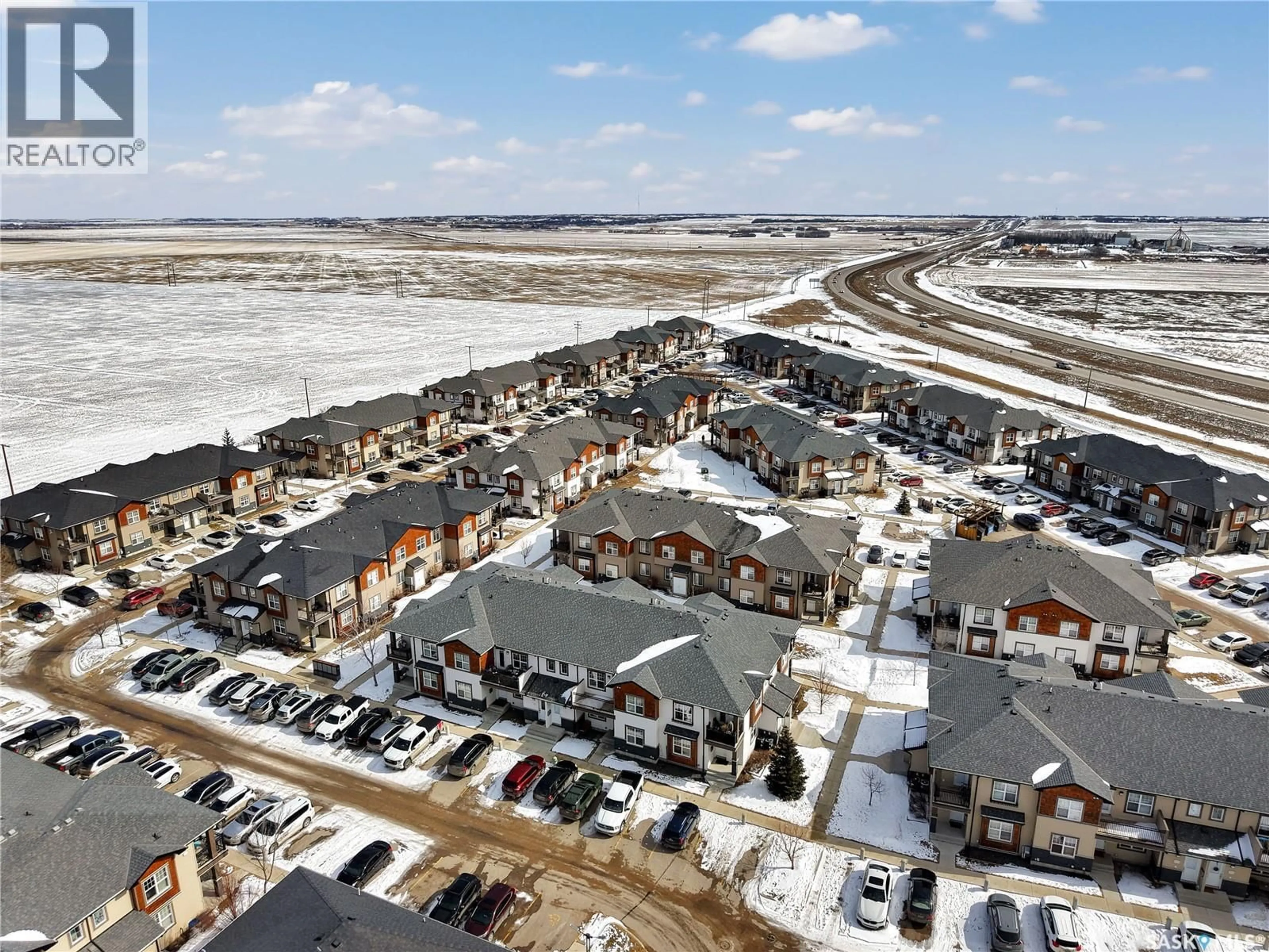 A pic from outside/outdoor area/front of a property/back of a property/a pic from drone, street for 1015 - 103 PATRICK CRESCENT, Saskatoon Saskatchewan S7W0M3