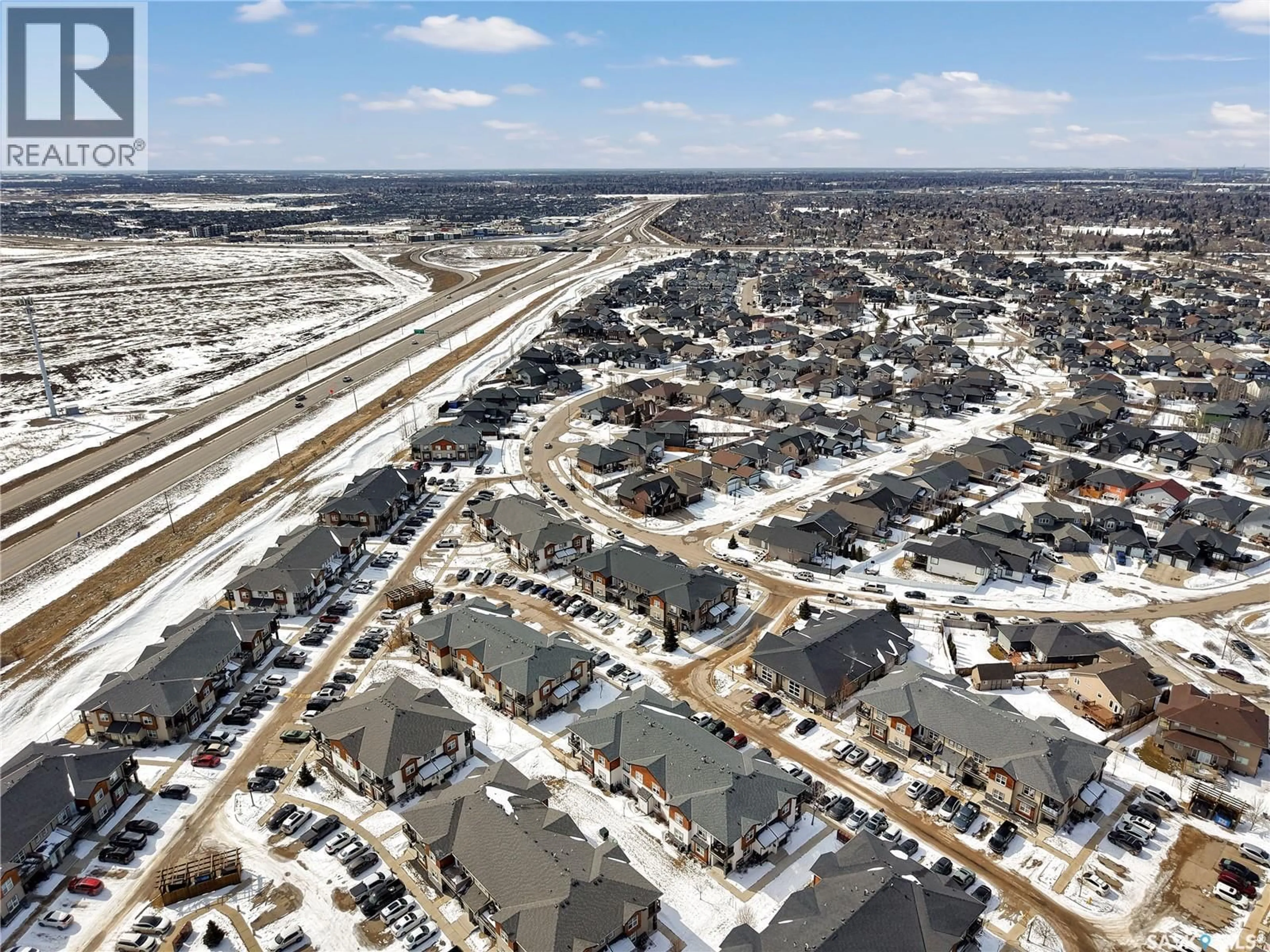 A pic from outside/outdoor area/front of a property/back of a property/a pic from drone, street for 1015 - 103 PATRICK CRESCENT, Saskatoon Saskatchewan S7W0M3