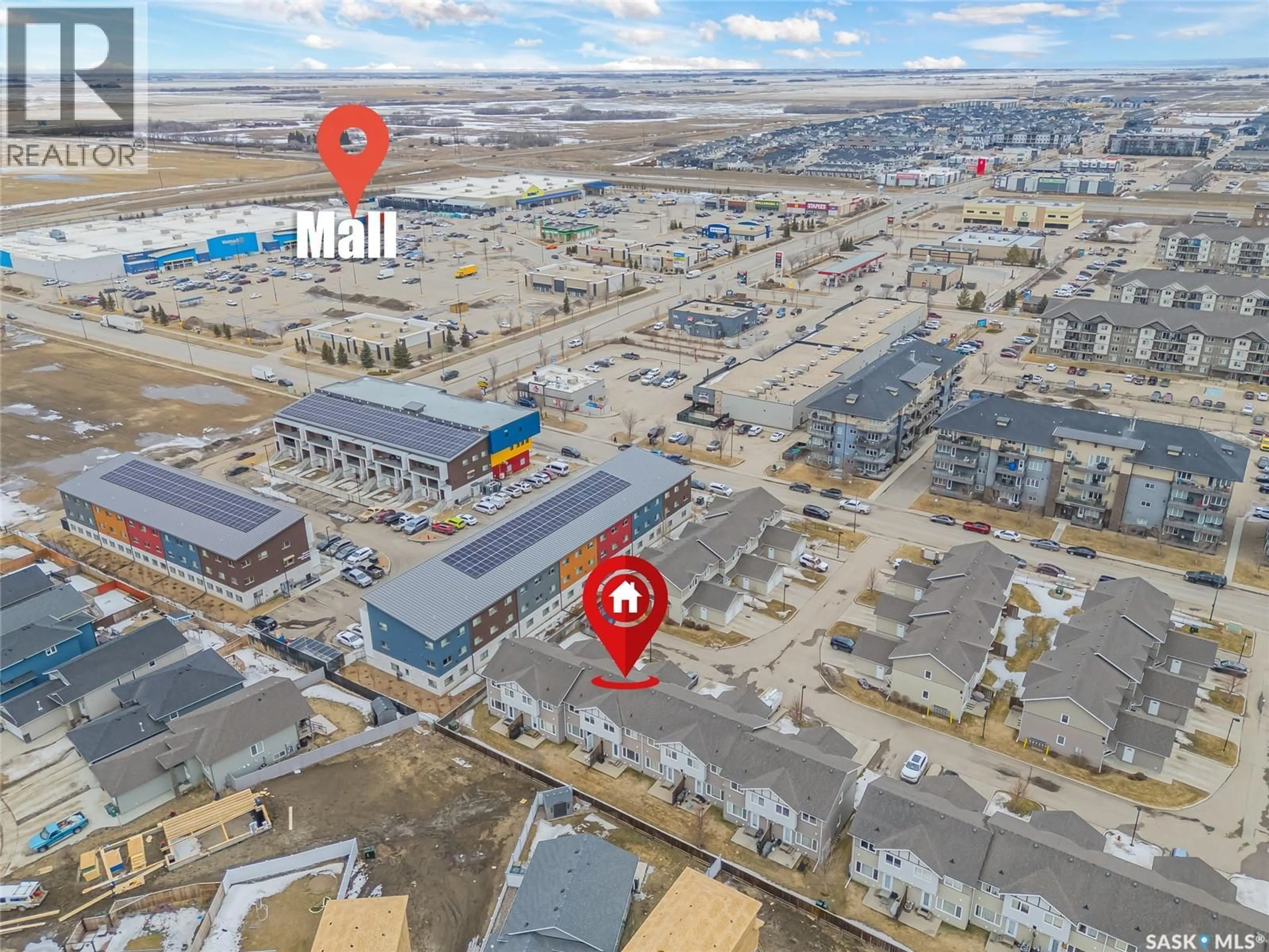 A pic from outside/outdoor area/front of a property/back of a property/a pic from drone, street for 715 - 1406 HART ROAD, Saskatoon Saskatchewan S7M3Y7