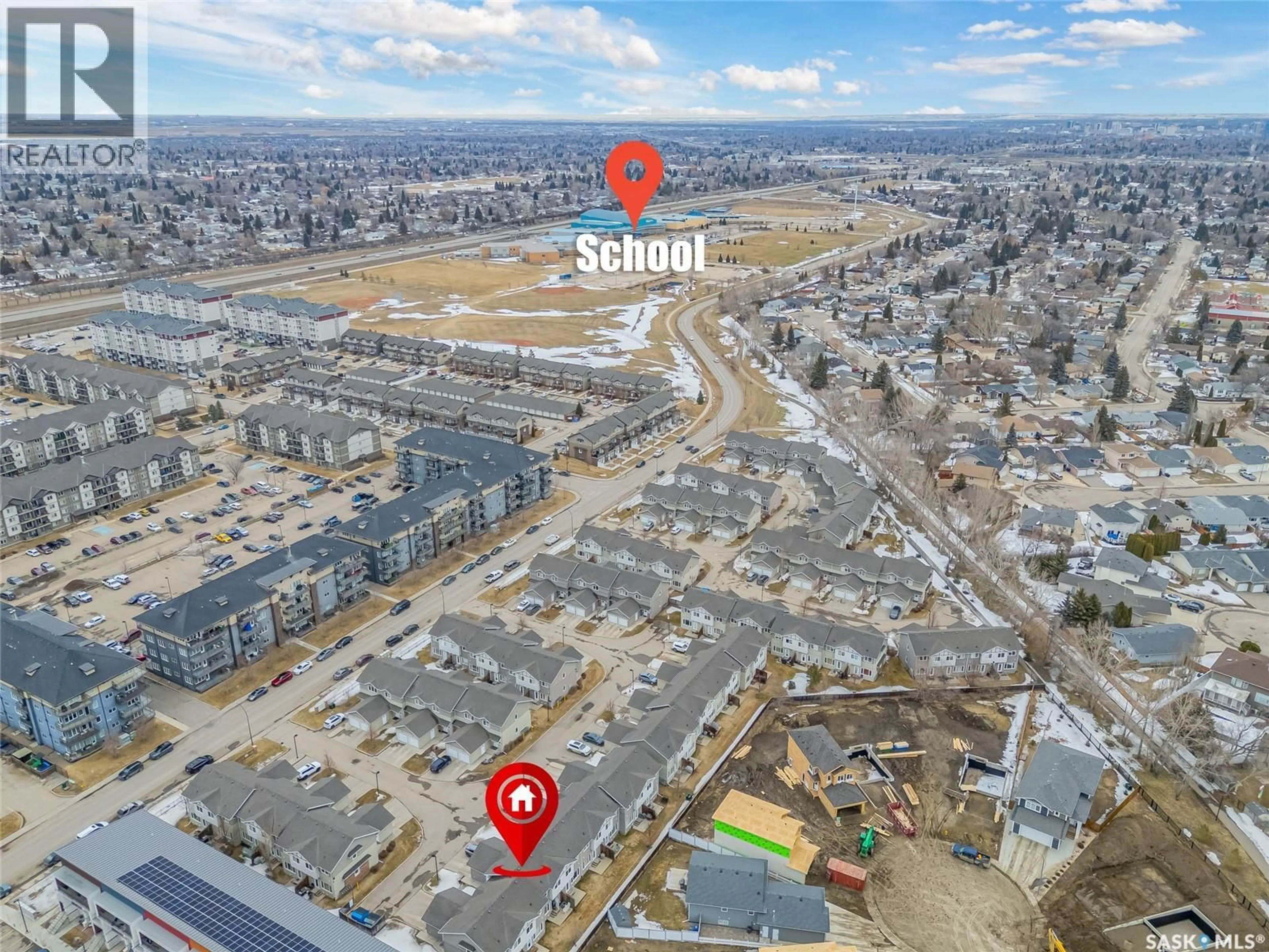 A pic from outside/outdoor area/front of a property/back of a property/a pic from drone, street for 715 - 1406 HART ROAD, Saskatoon Saskatchewan S7M3Y7