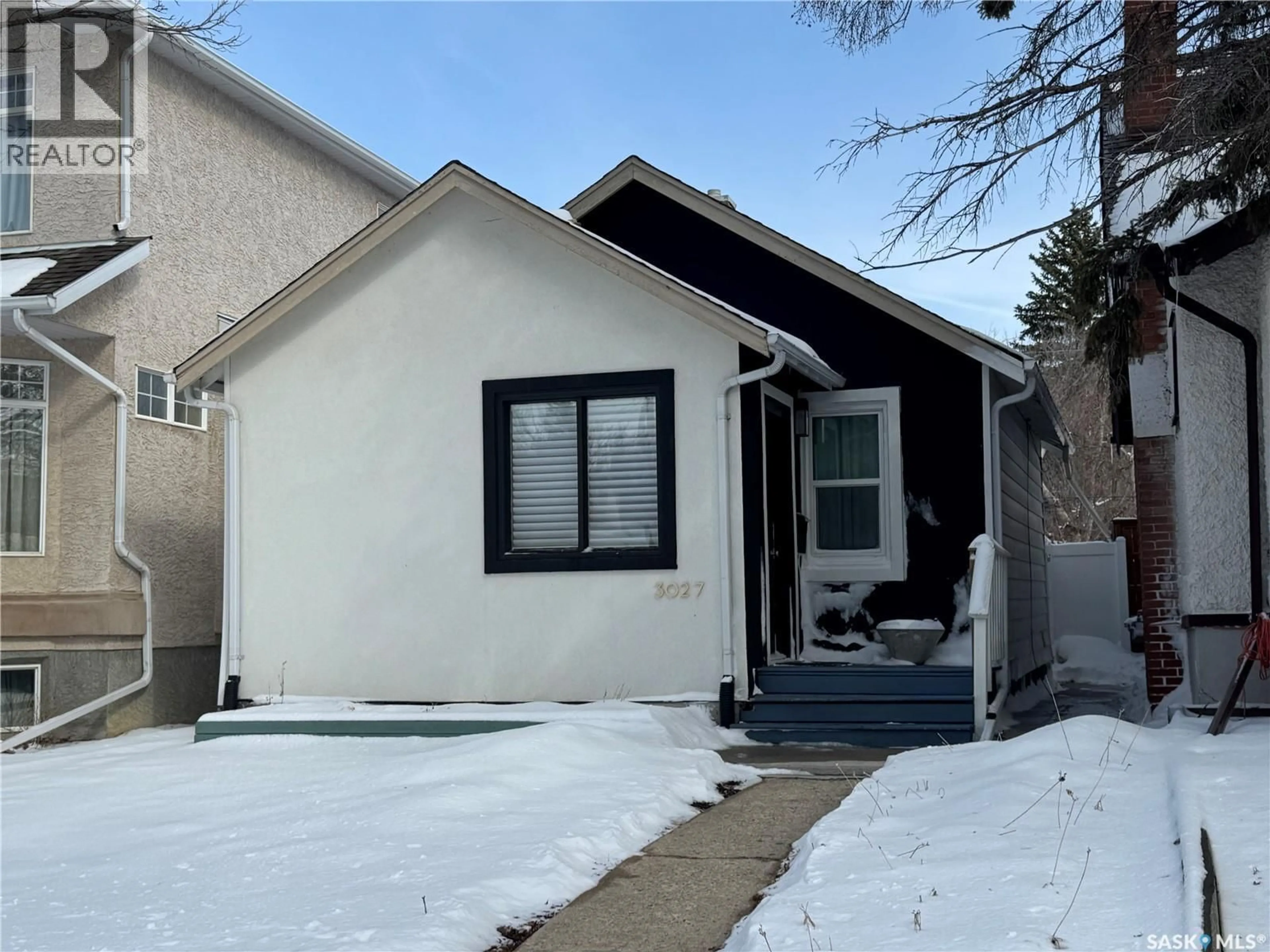 Home with vinyl exterior material, street for 3027 ROBINSON STREET, Regina Saskatchewan S4S1V3