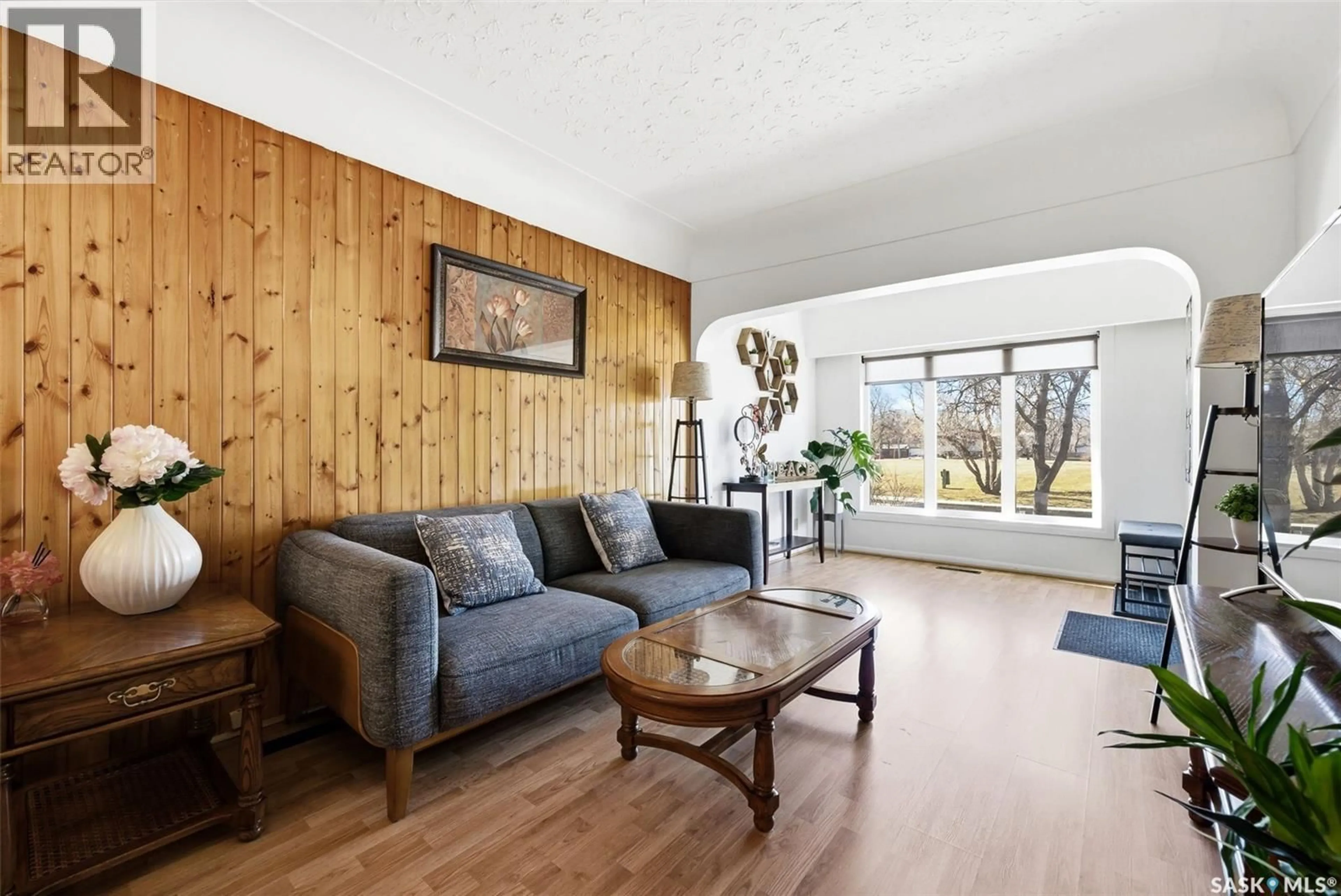 Living room with furniture, wood/laminate floor for 1441 ATHOL STREET, Regina Saskatchewan S4T3C7