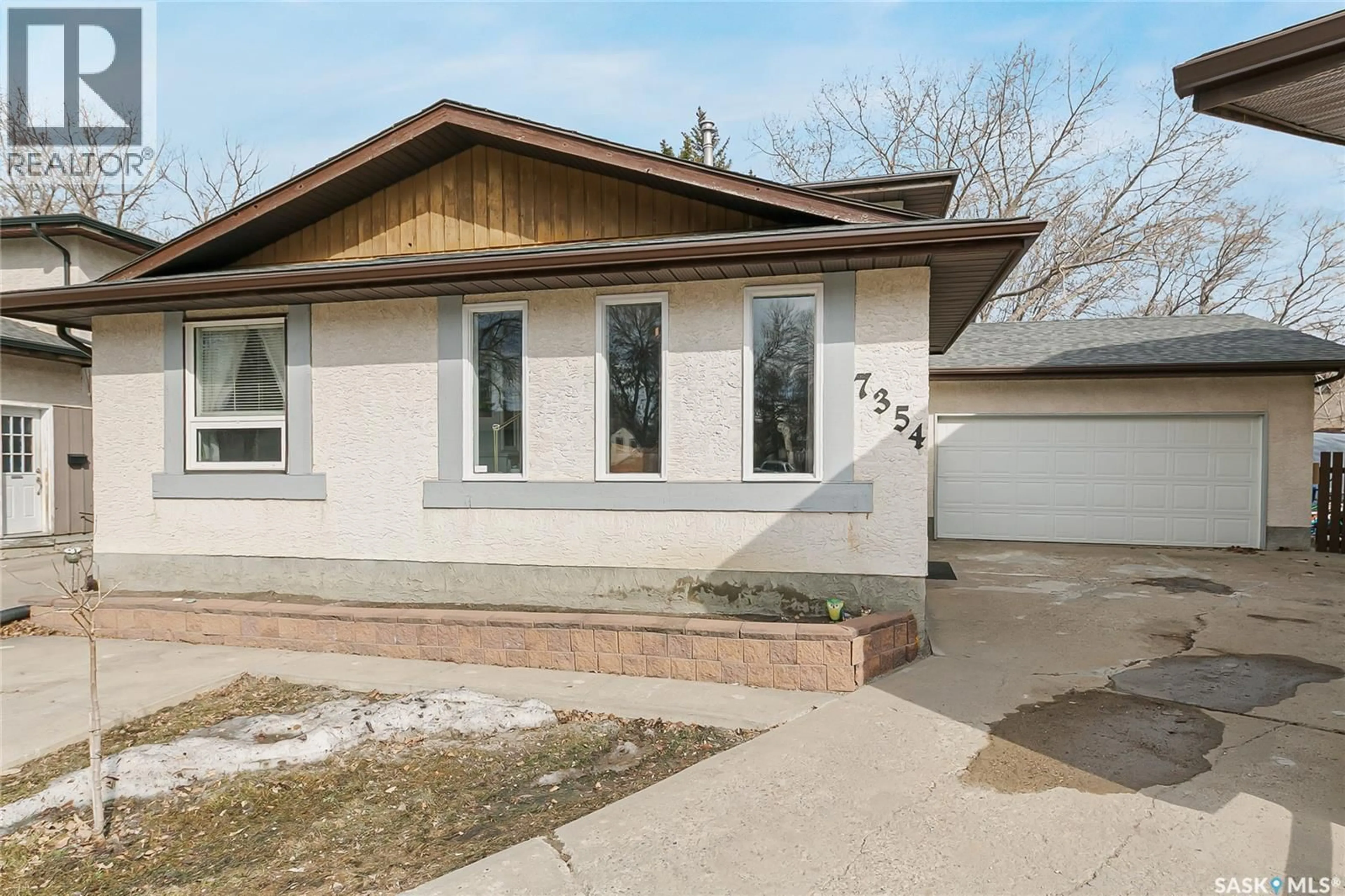 Home with vinyl exterior material, street for 7354 BLAKENEY DRIVE, Regina Saskatchewan S4X2M5