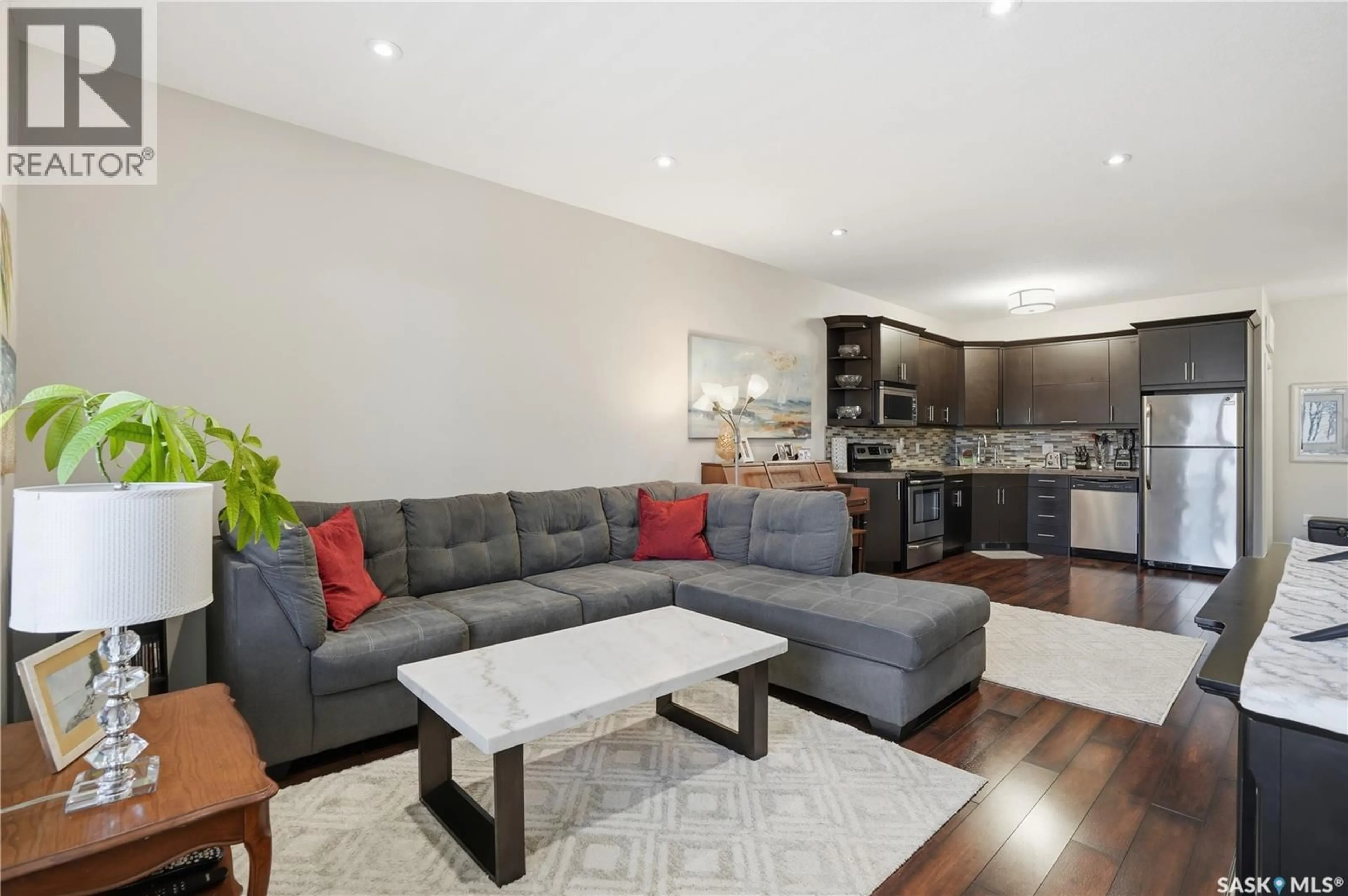 Living room with furniture, wood/laminate floor for 3237 GREEN BANK ROAD, Regina Saskatchewan S4V1P4