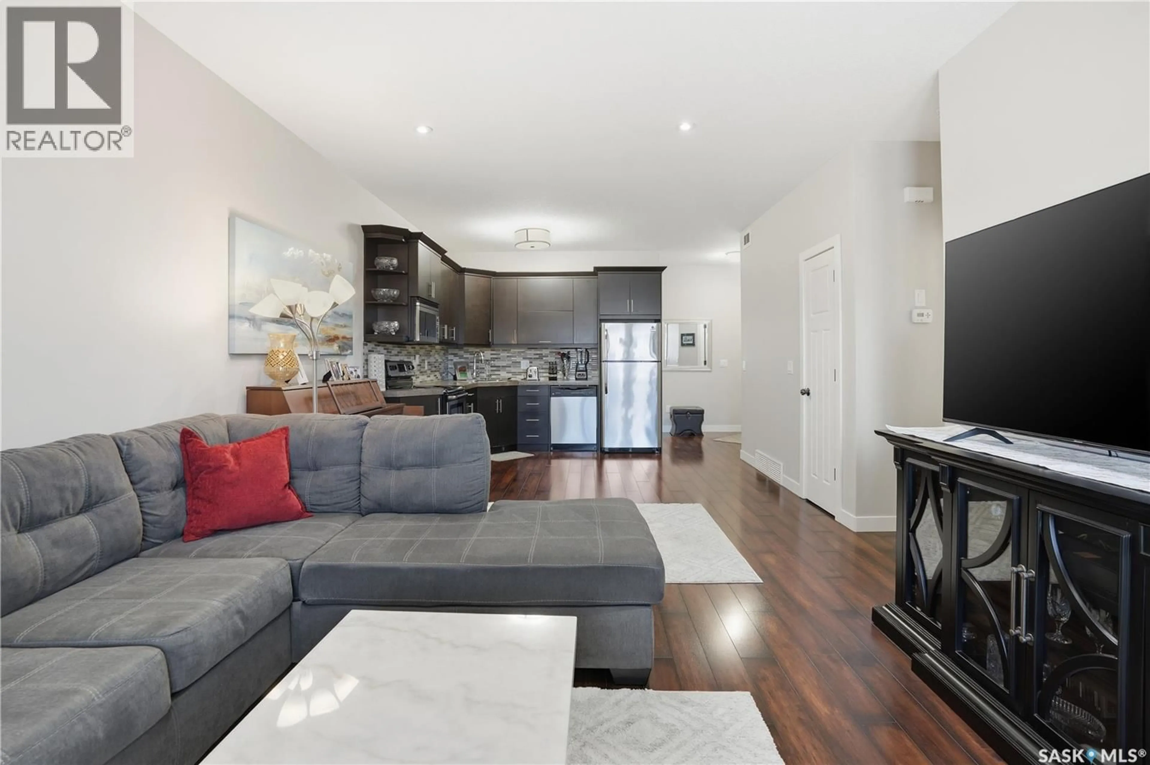 Living room with furniture, wood/laminate floor for 3237 GREEN BANK ROAD, Regina Saskatchewan S4V1P4