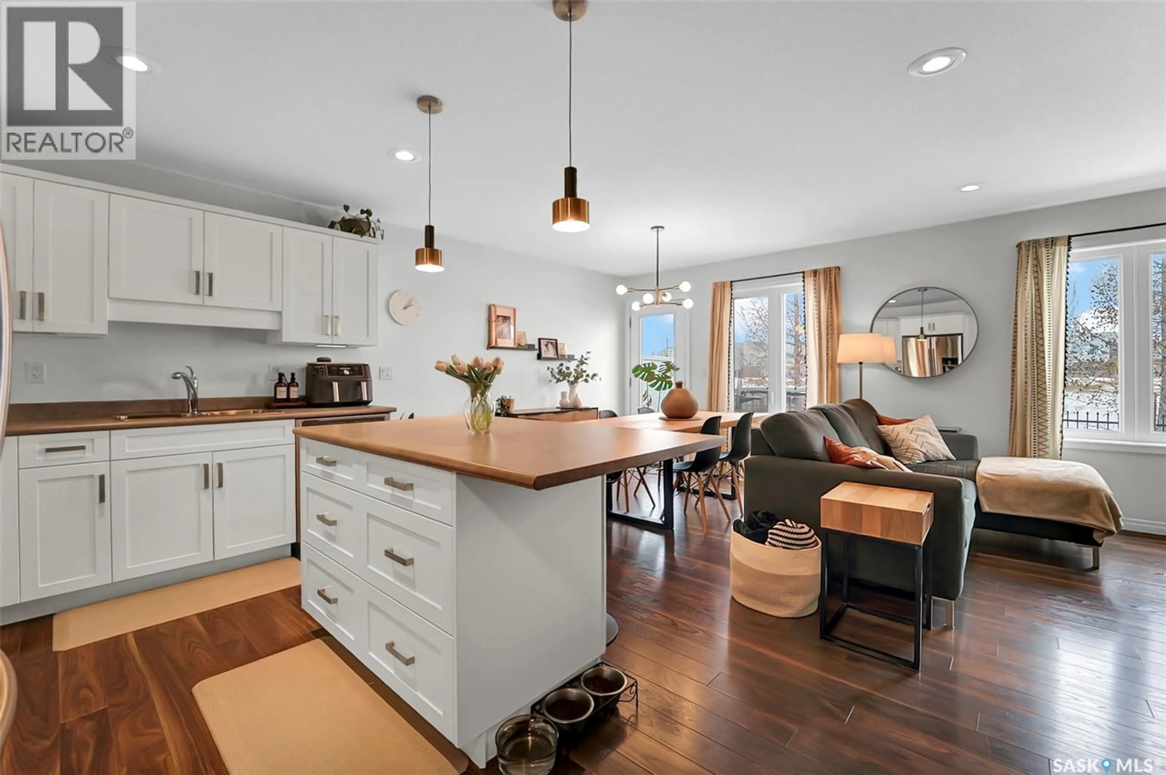Open concept kitchen, wood/laminate floor for 9 DAWSON CRESCENT, Saskatoon Saskatchewan S7R0L6