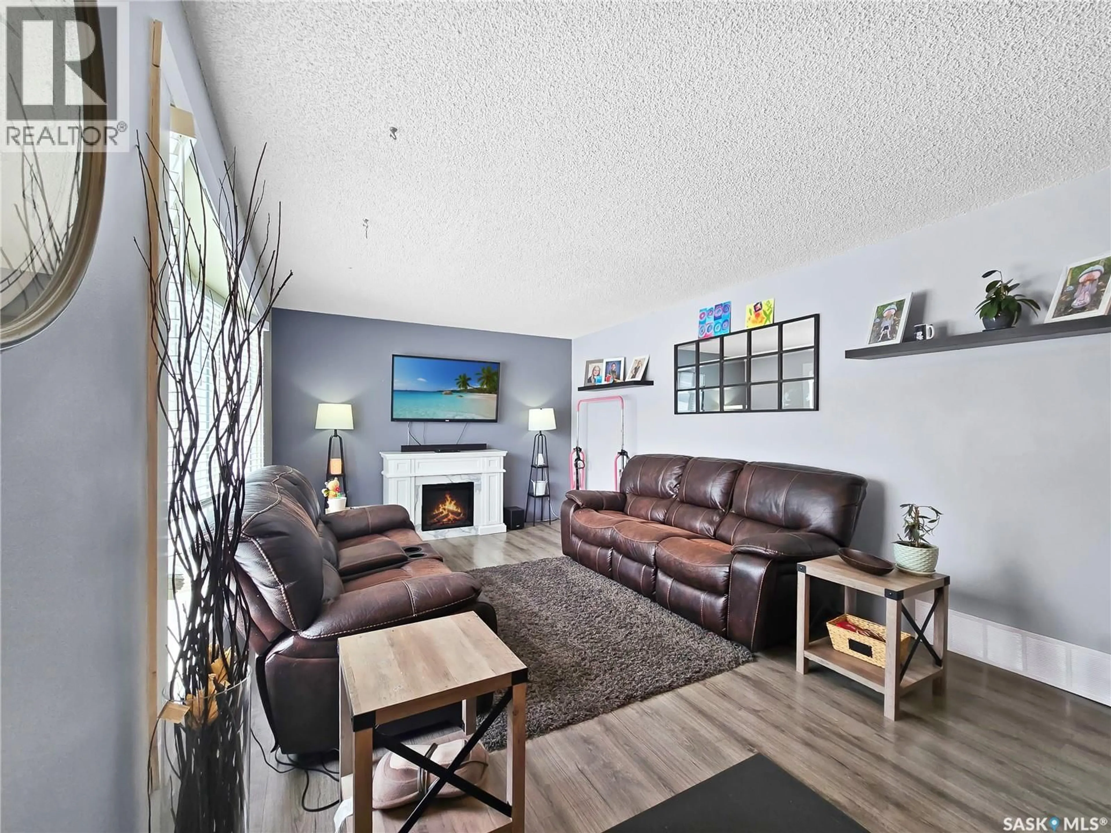Living room with furniture, wood/laminate floor for 804 ROBISON STREET, Indian Head Saskatchewan S0G2K0