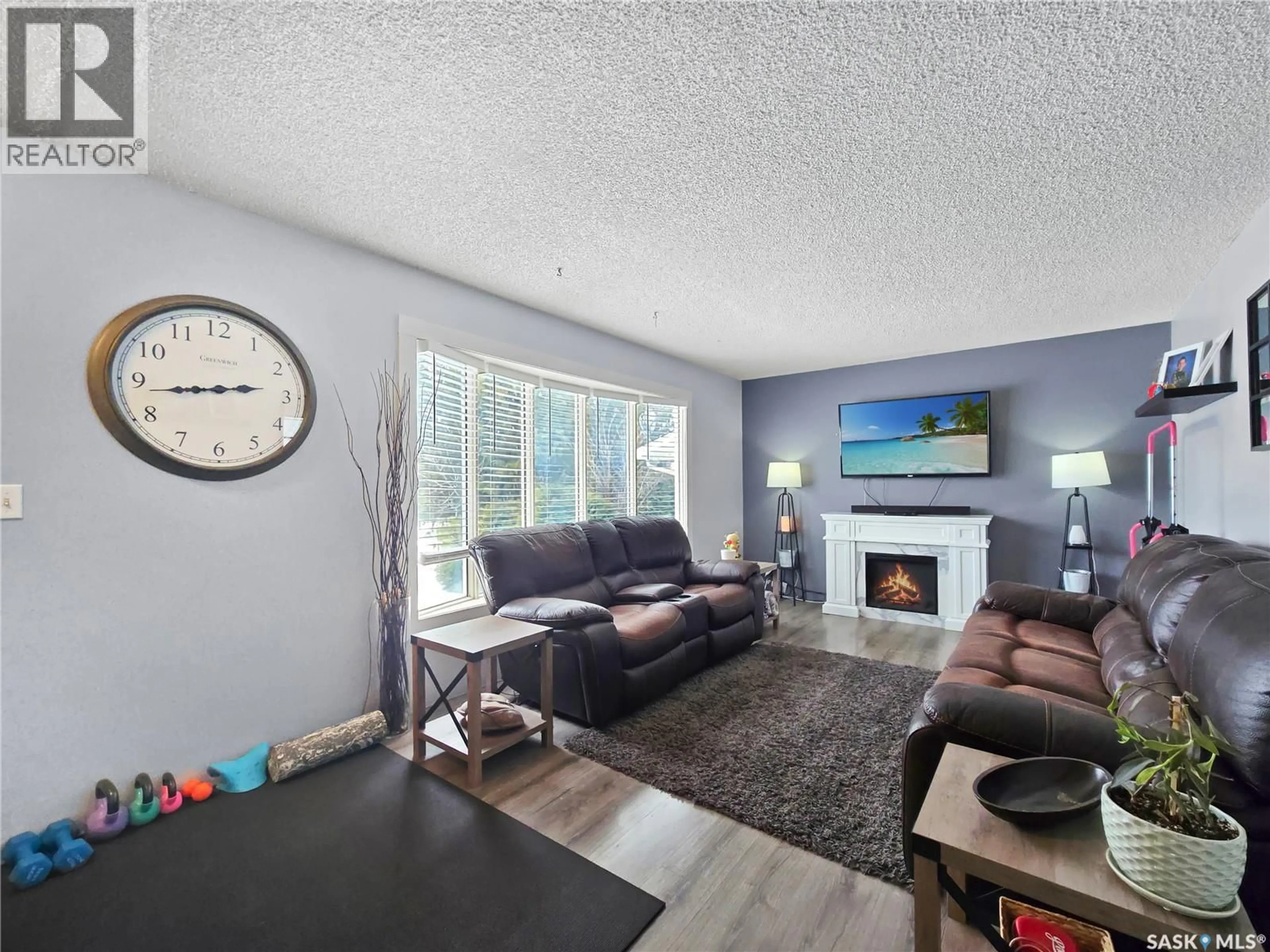 Living room with furniture, wood/laminate floor for 804 ROBISON STREET, Indian Head Saskatchewan S0G2K0