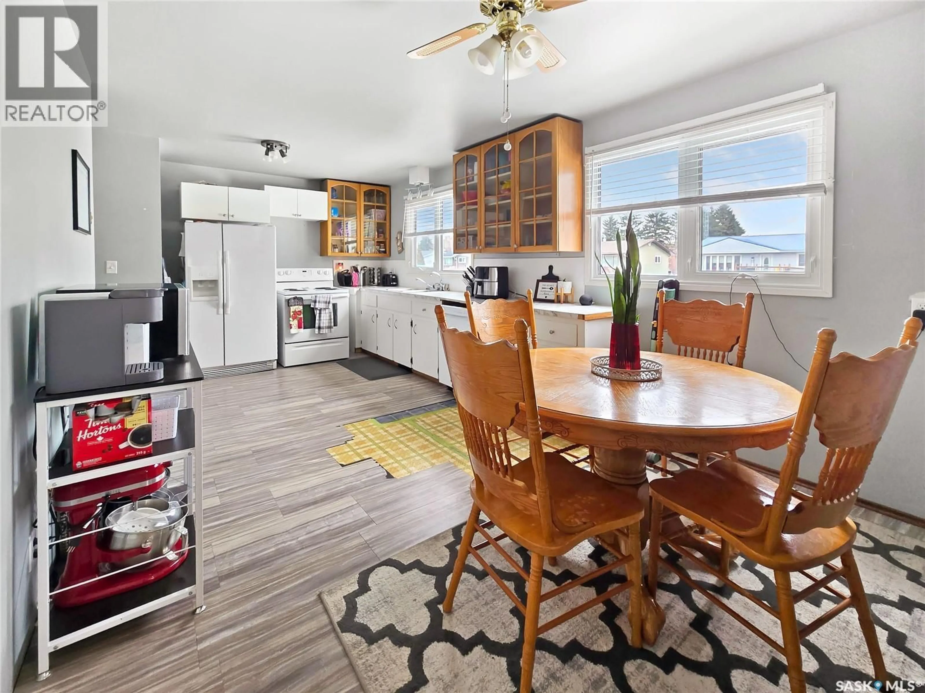 Open concept kitchen, wood/laminate floor for 804 ROBISON STREET, Indian Head Saskatchewan S0G2K0