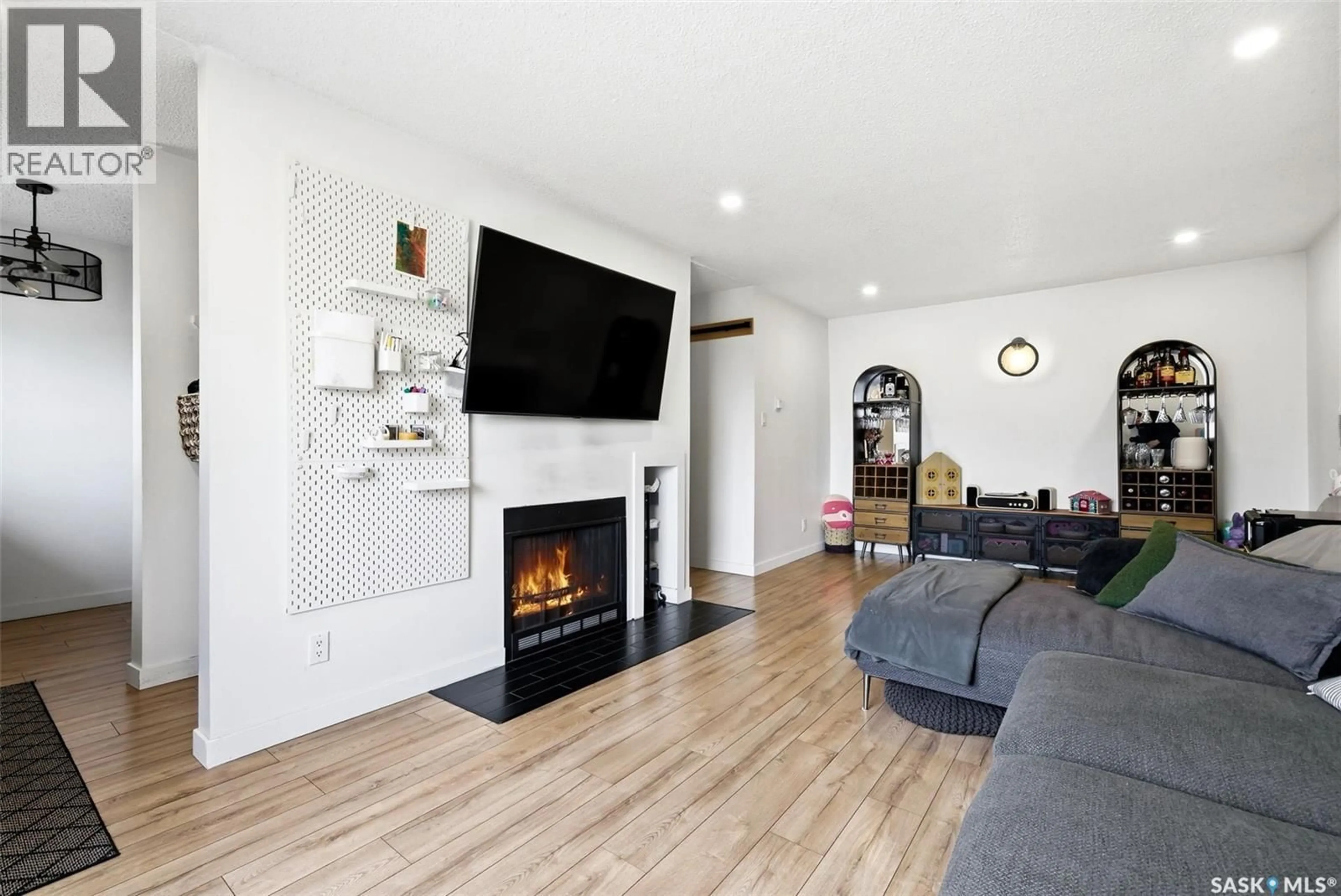 Living room with furniture, wood/laminate floor for 67 - 208 RODENBUSH DRIVE, Regina Saskatchewan S4R8C7