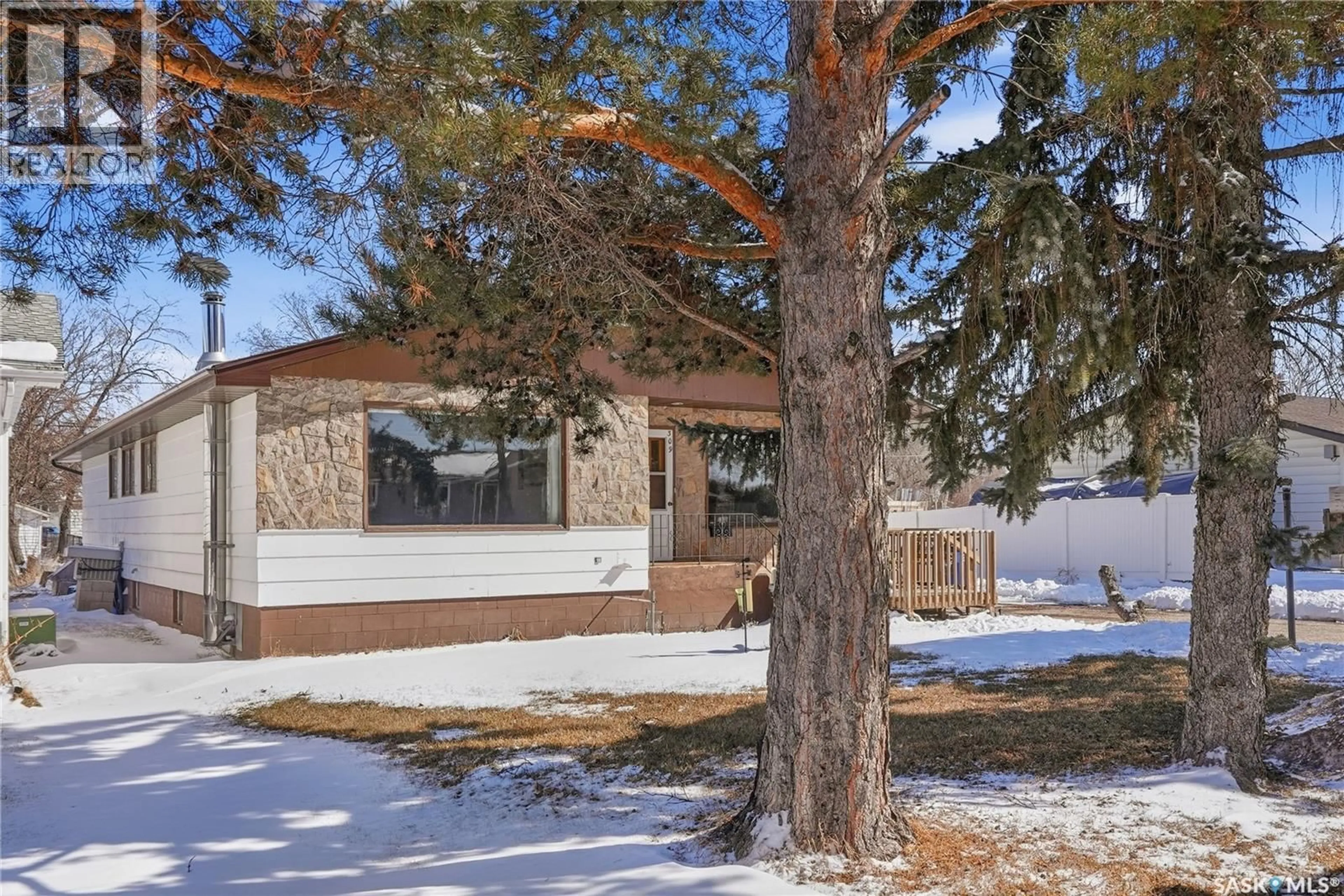 Home with vinyl exterior material, street for 307 MAIN STREET, Delisle Saskatchewan S0L0P0