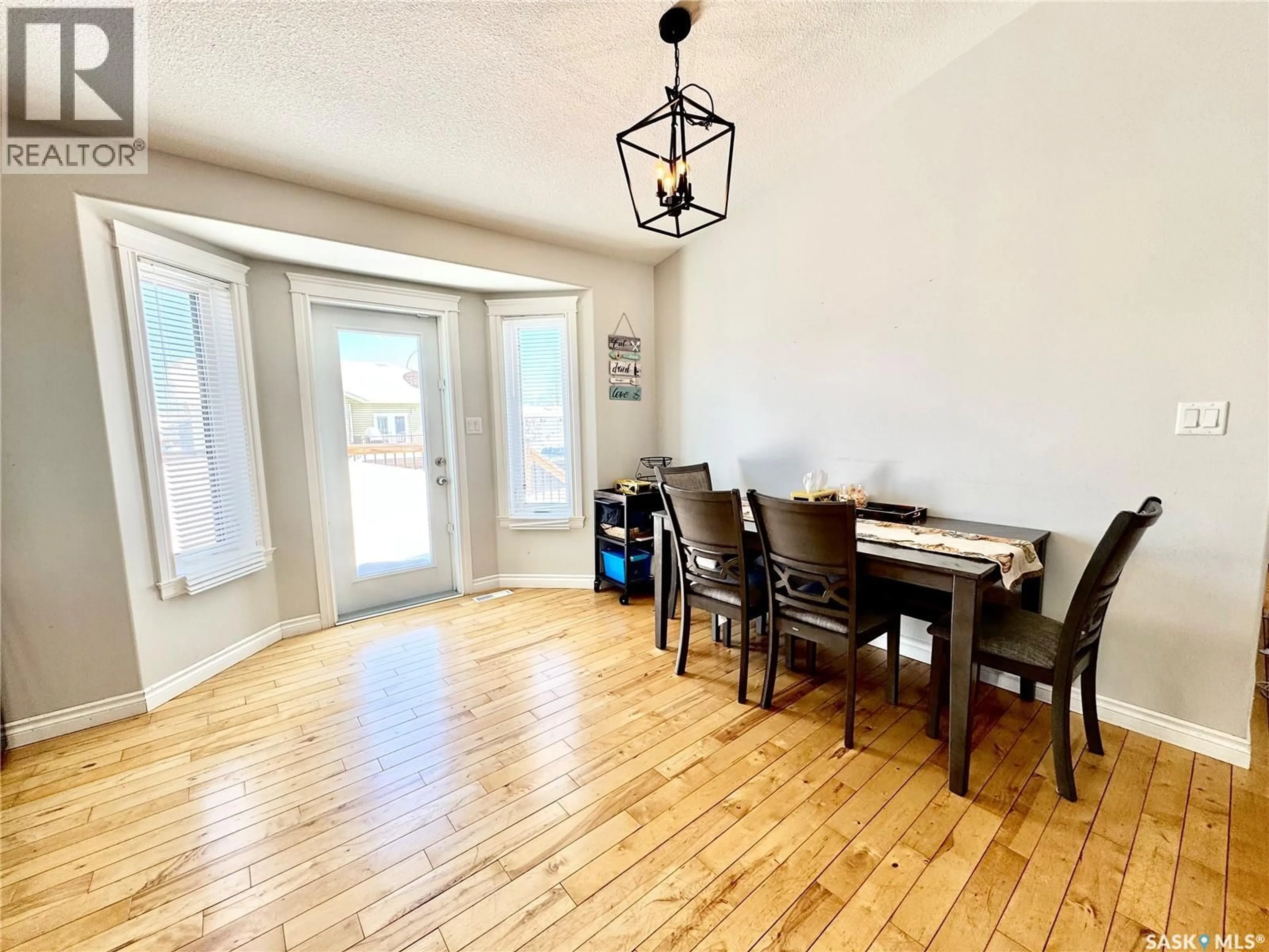 Dining room, wood/laminate floor for 42 JOHN HICKS PLACE, Prince Albert Saskatchewan S6V8E5