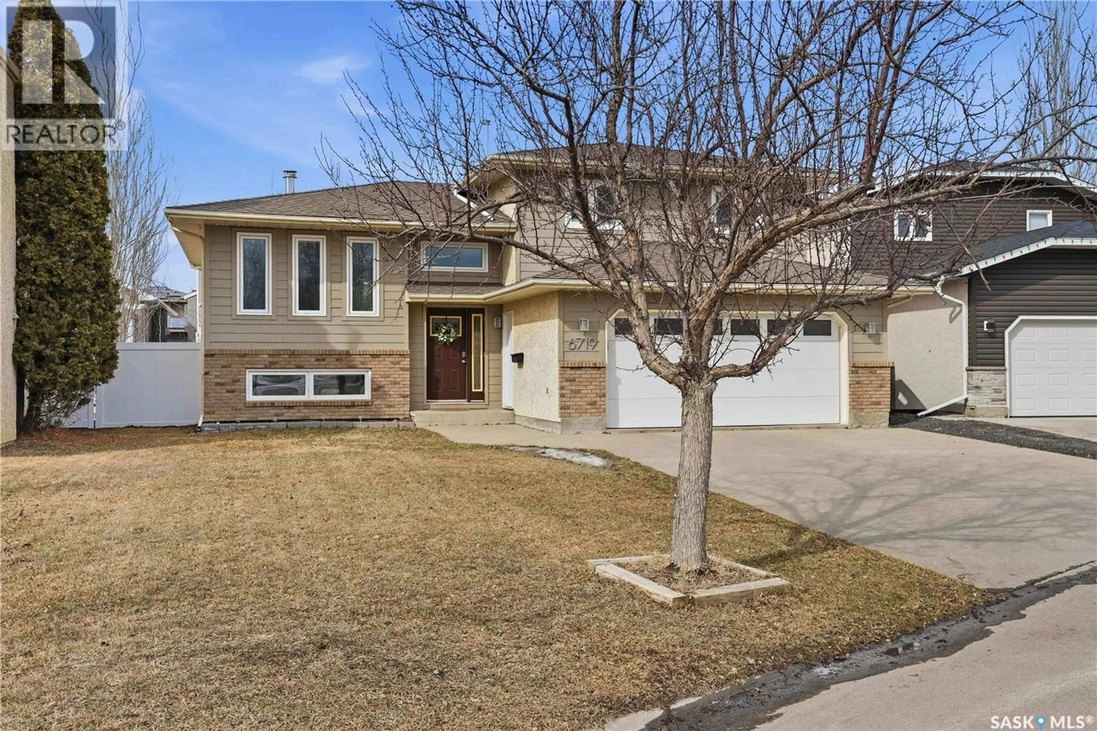 Home with brick exterior material, street for 6719 MAPLECREST PLACE, Regina Saskatchewan S4X3Z1